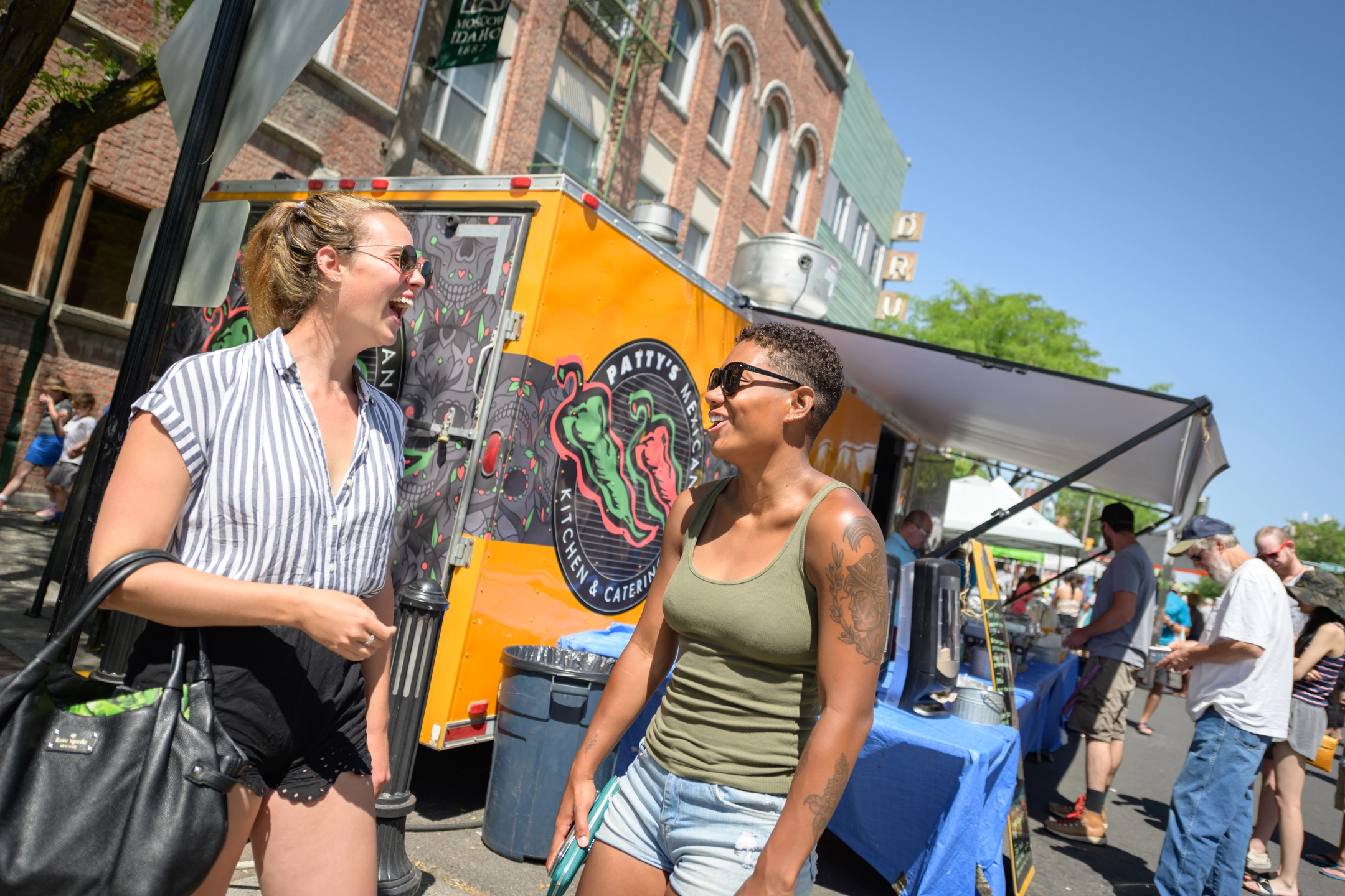 Students and community members gather on Main Street for Moscow Farmer's Market summer 2019