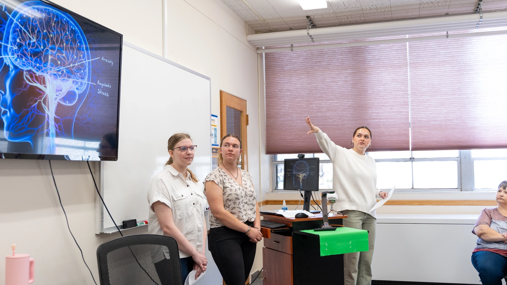 Photos of high schoolers attending an event held at the Niccolls building to showcase what the CALS program has to offer. This field trip included some activities, presentations, tours of the school and interactions with staff and current U of I students.