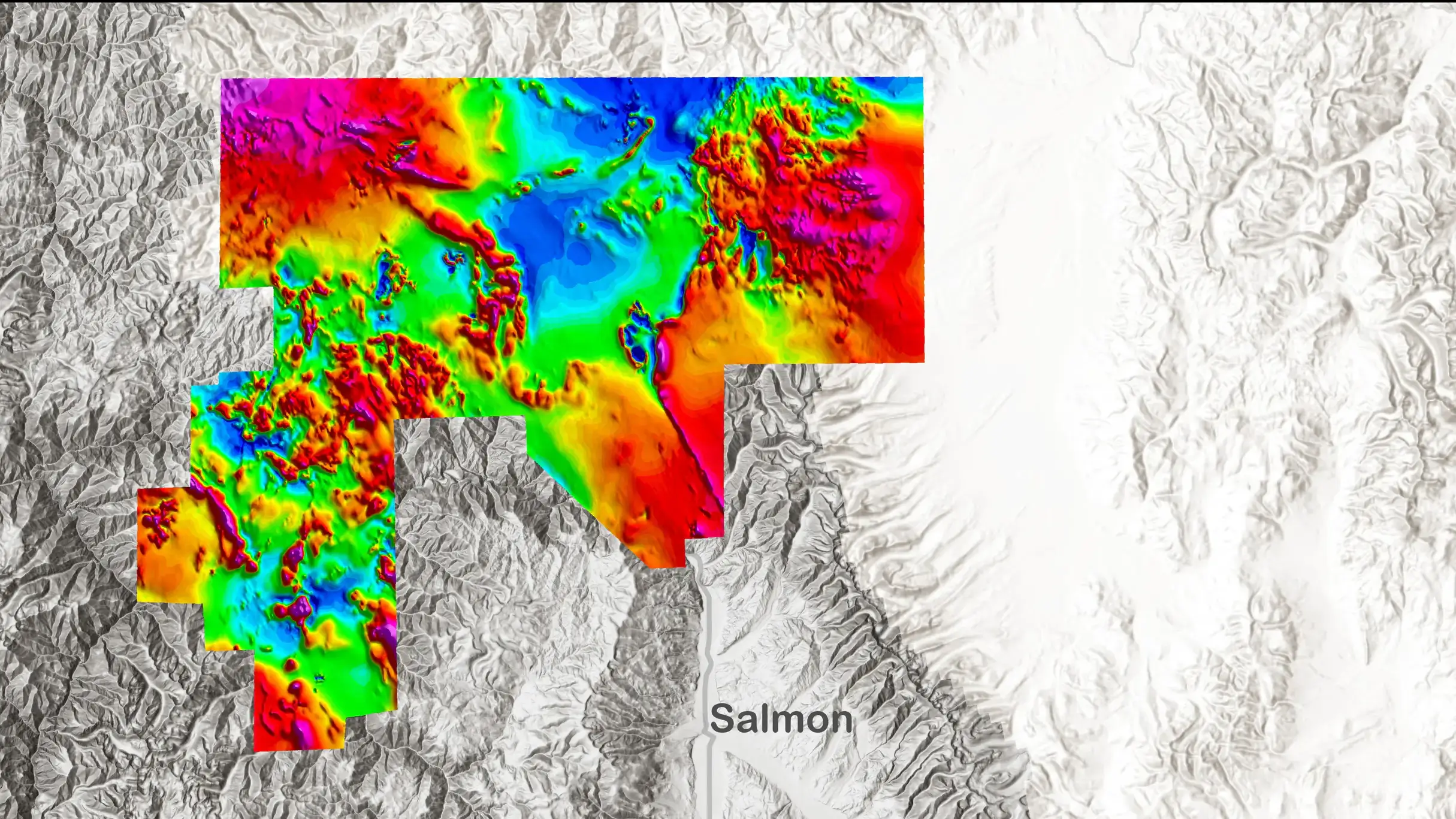 A black and white map of Idaho with an overlay of colors depicting magnetic values of rocks.