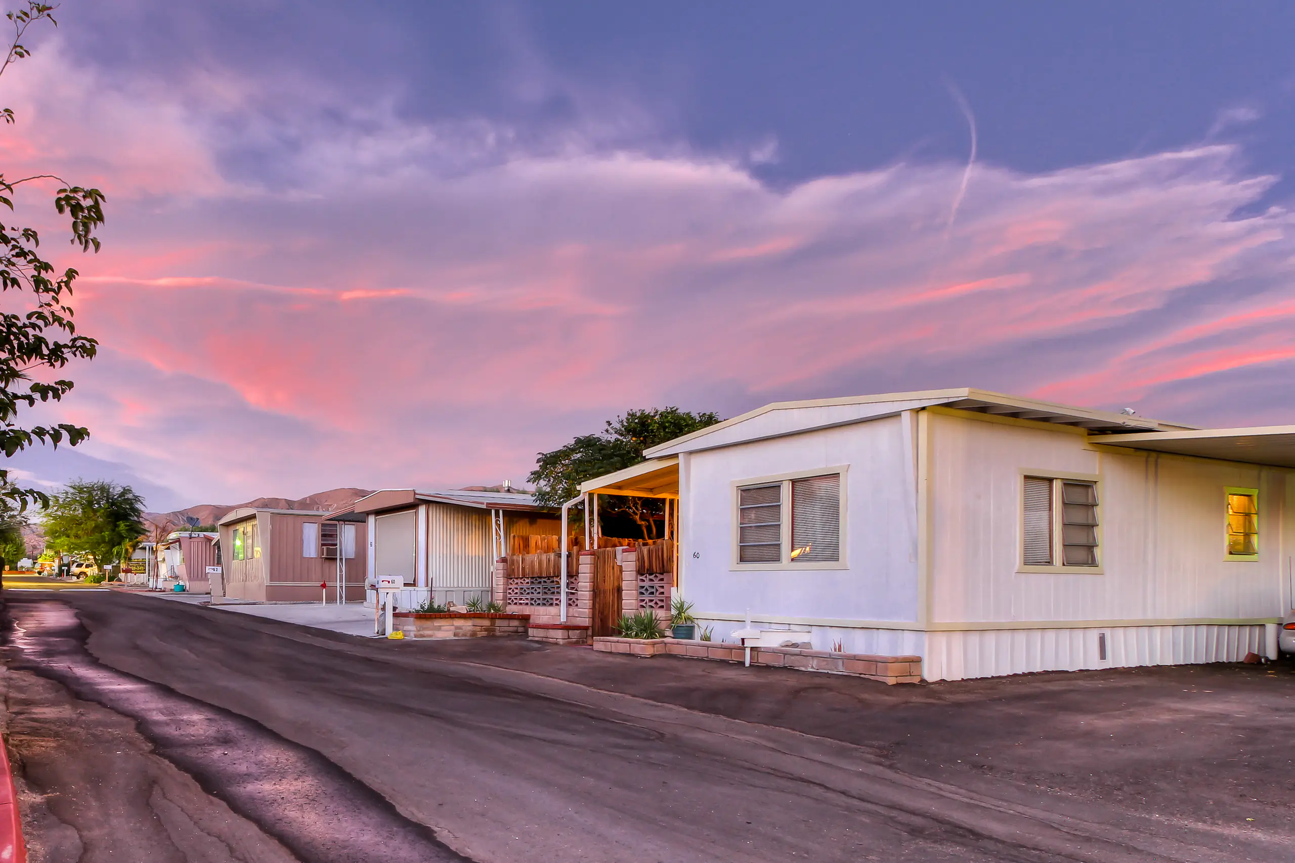 A row of manufactured homes in a trailer park.