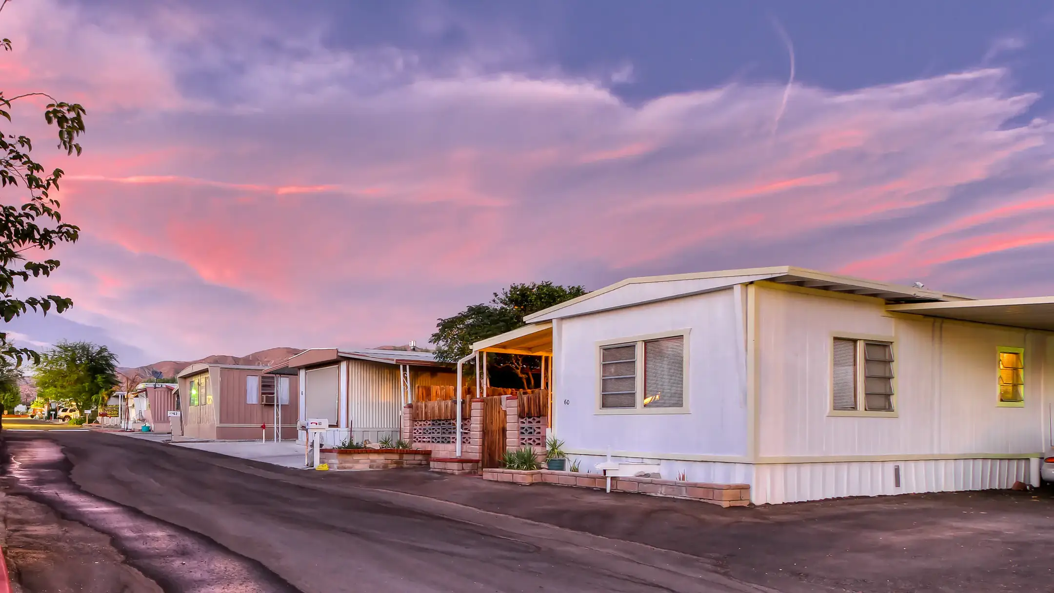 A row of manufactured homes in a trailer park.