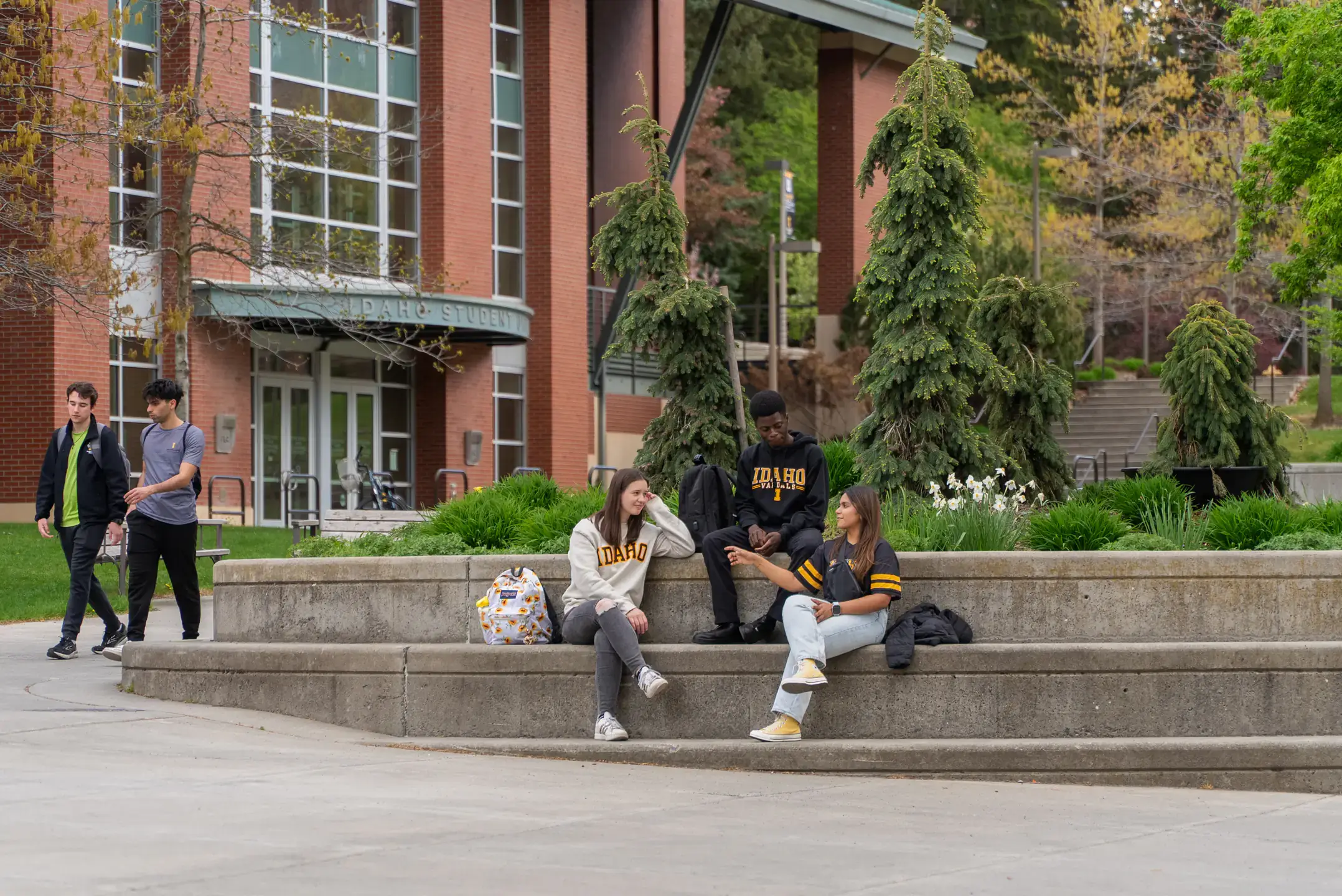 Students gather and socialize along the Academic Mall on Monday, May 5, 2025.