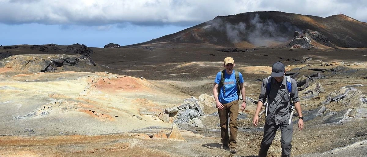 two people traversing over geological wonders