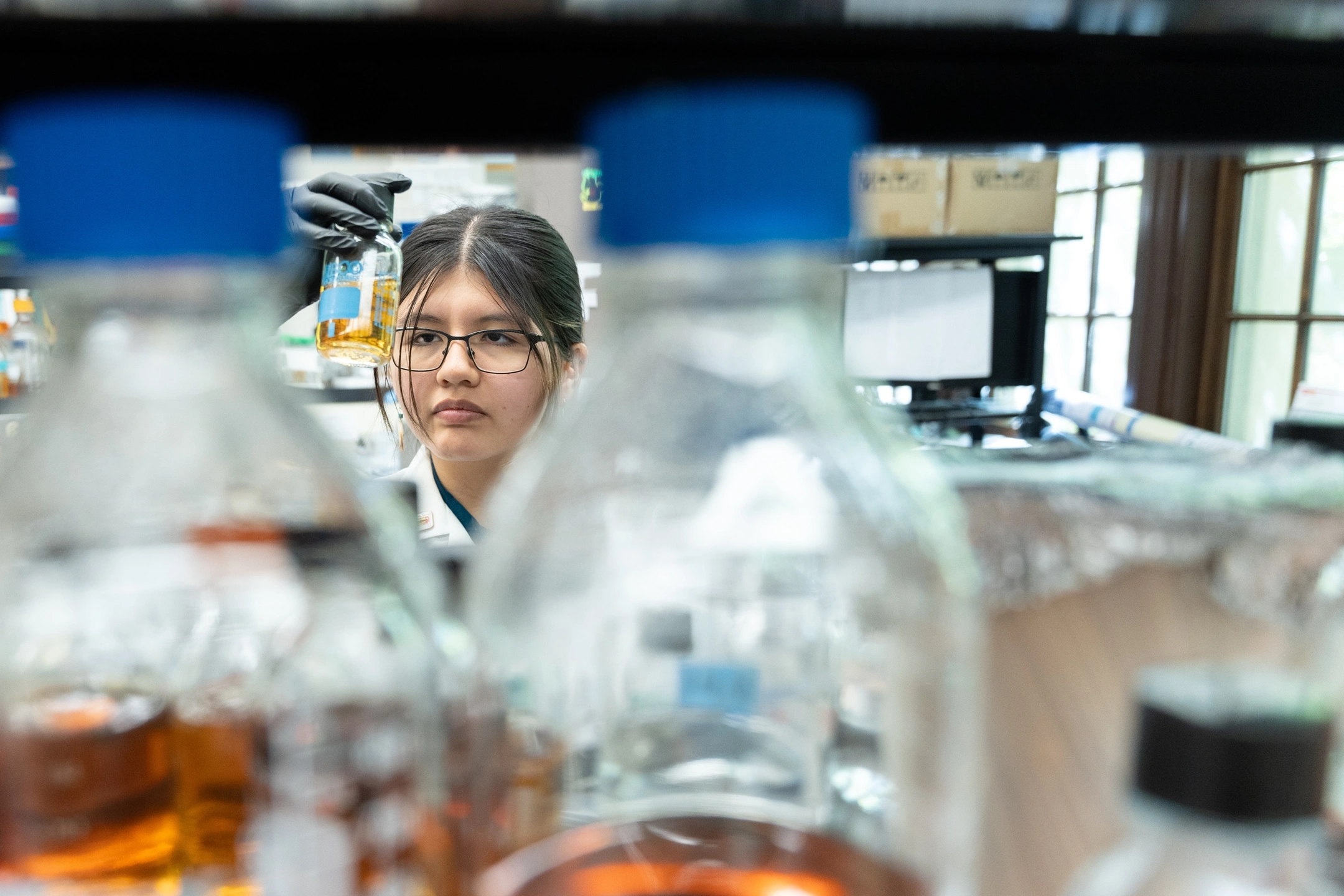 Goldwater scholar Dayna Bruiton from Caldwell, Idaho working in the Paul Rowley lab working with Yeast growth medium.