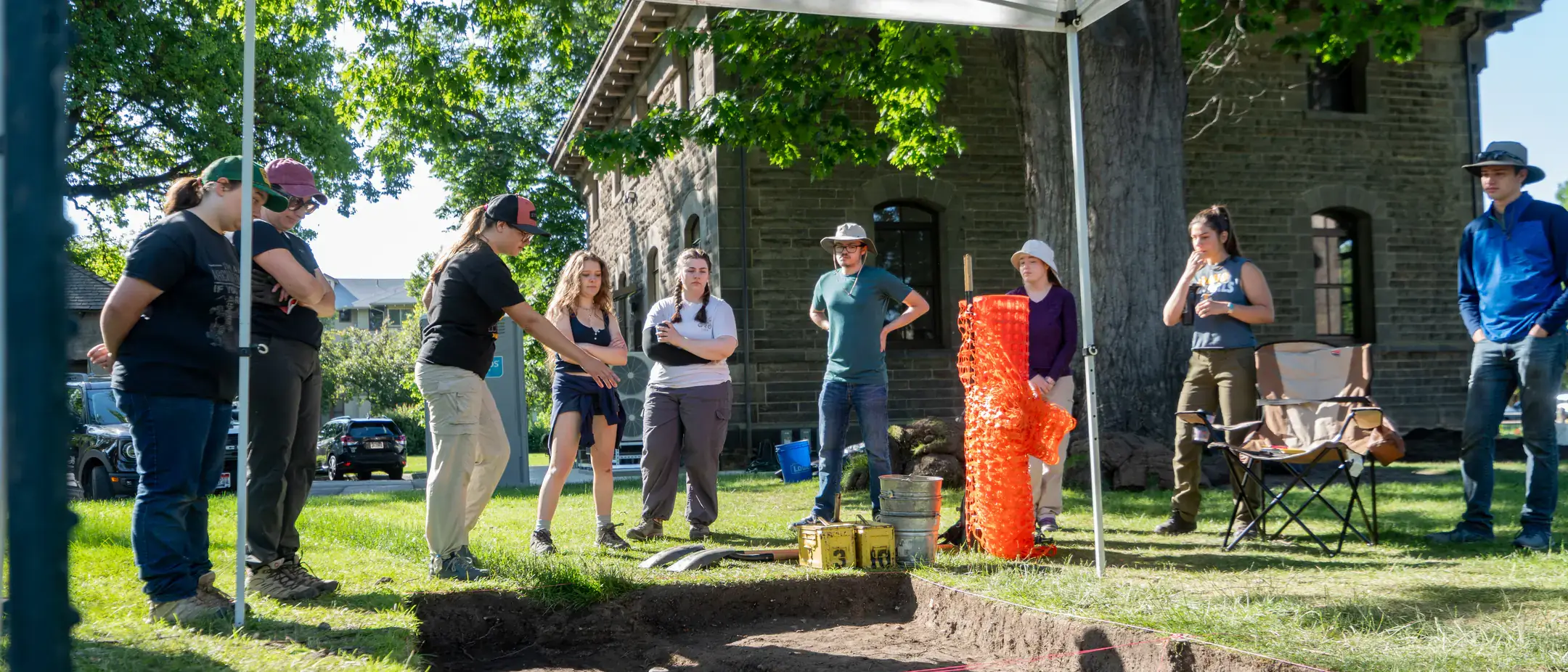 University of Idaho anthropology professors Renae Campbell and Mark Warner lead a public archaeology dig on the grounds of the Old U.S. Assay Office in downtown Boise June 2-13, 2025. The dig, part of the University of Idaho's Archaeological Field School, was open to the public to observe and participate in hands-on activities. The project aims to make archaeology more accessible and interesting to the public, showcasing Idaho's history and allowing community members to engage with the process.