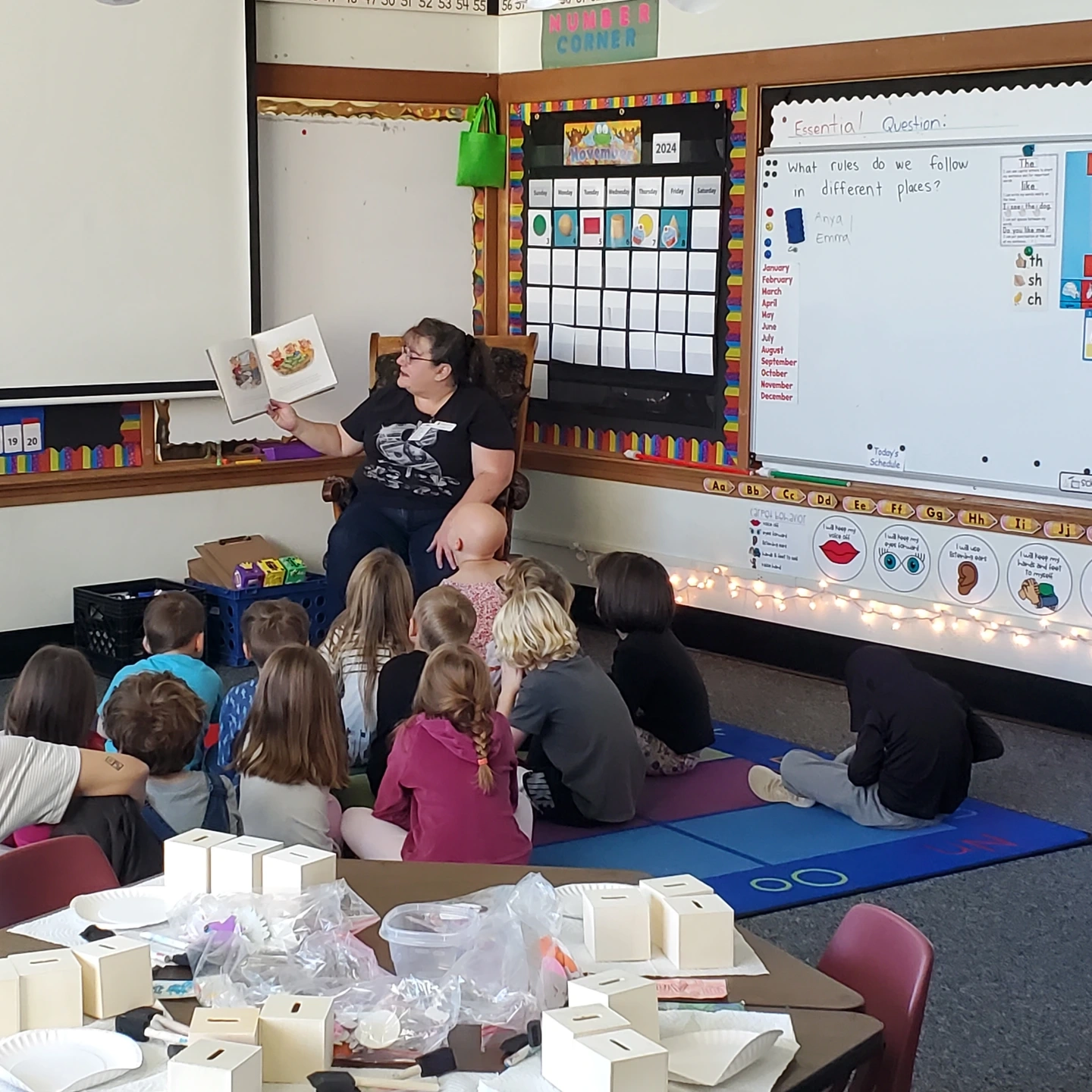 Children listen attentively to adult reader.