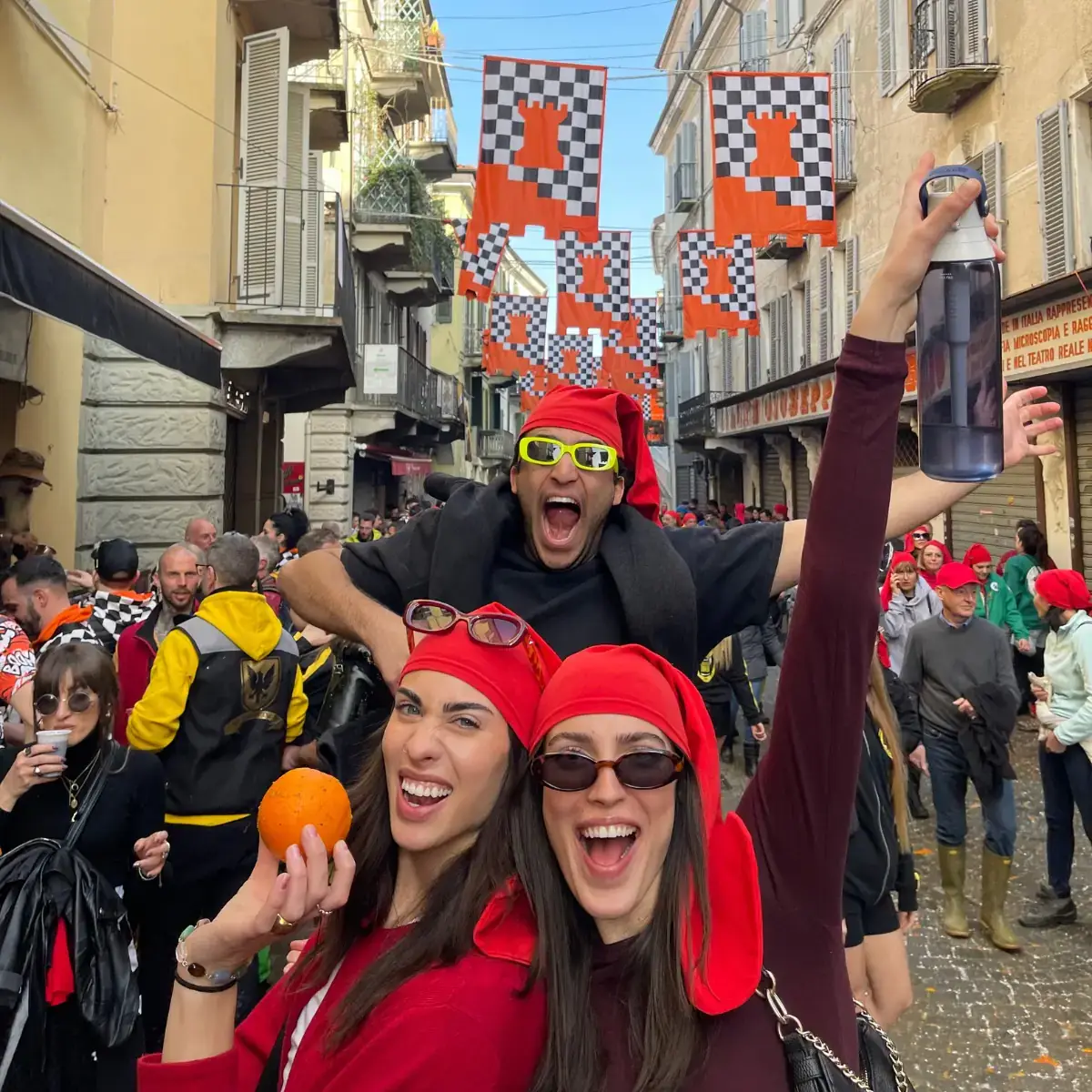 A group of friends having fun in the streets of an abroad city.