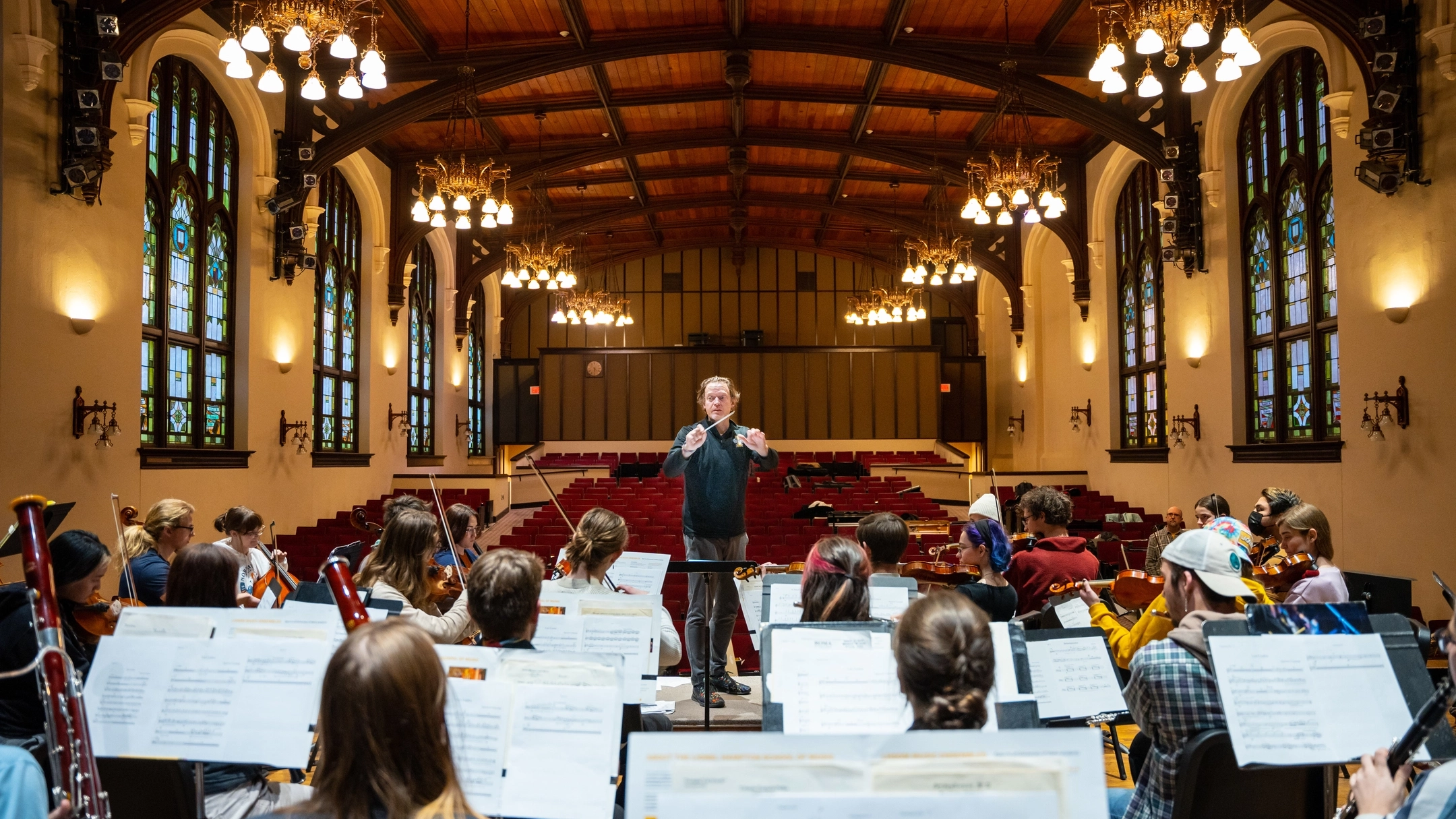 Photo of orchestra playing in Admin Auditorium. 