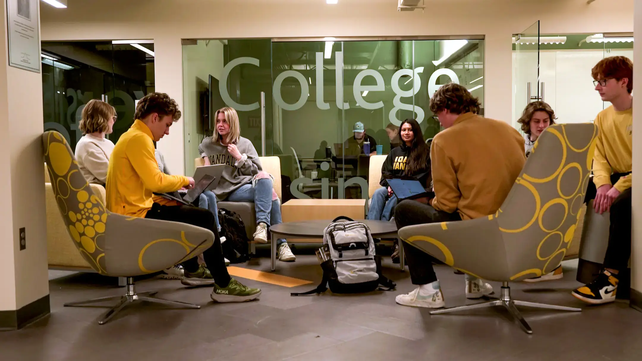 Students in common area with College window study rooms