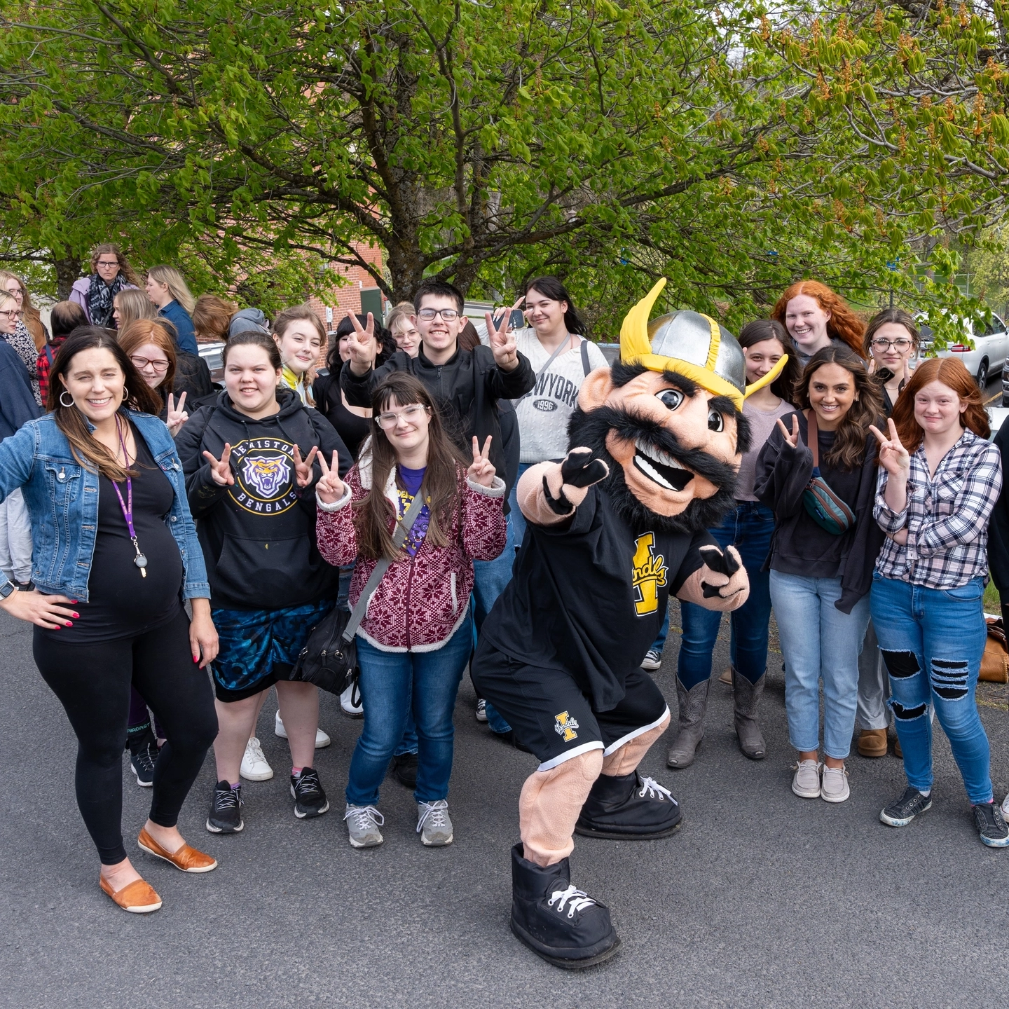 Photos of high schoolers attending an event held at the Niccolls building to showcase what the CALS program has to offer. This field trip included some activities, presentations, tours of the school and interactions with staff and current U of I students.
