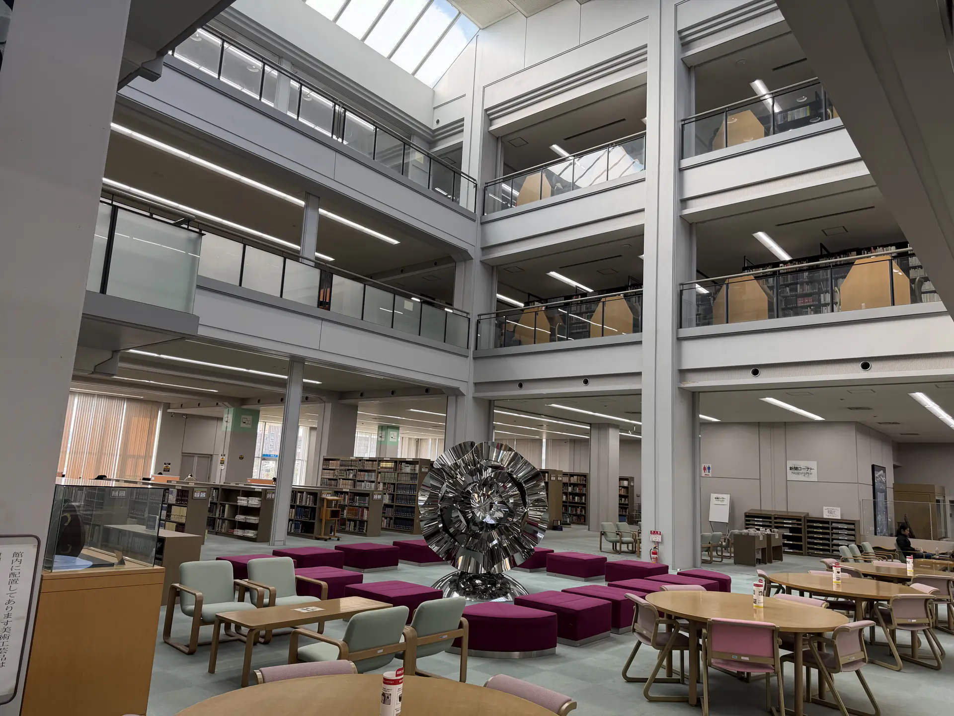 A sitting area under the skylight inside the HU Library.