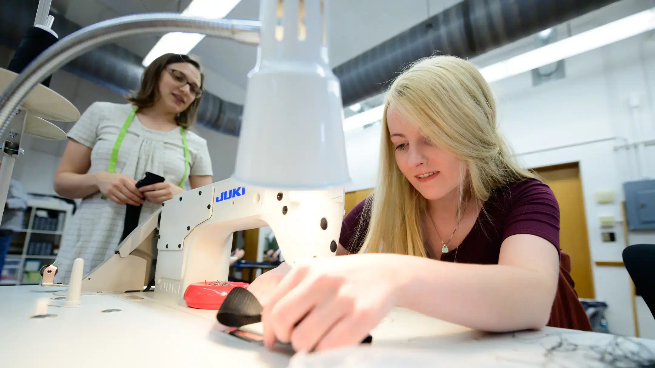 College of Agricultural and Life Sciences Family and Consumer Sciences textiles students making custom belts for the UI Marching Band to use in a performance during homecoming.