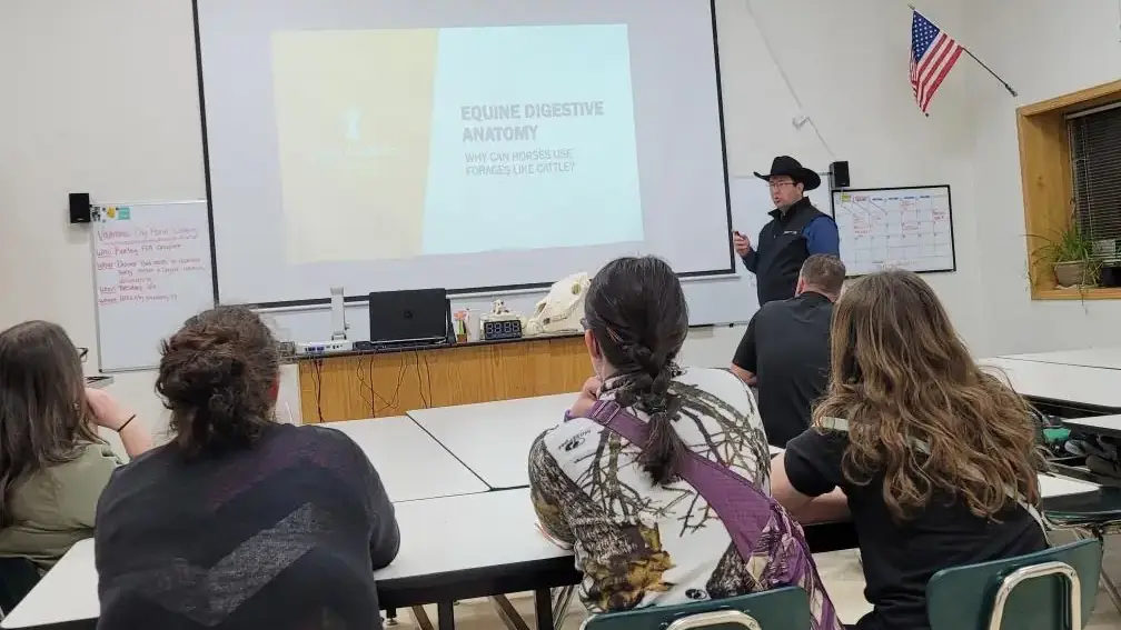 A presentation being shown to a group in a classroom.