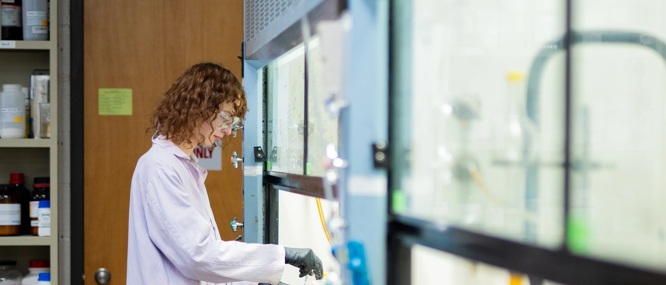 Maddie Moody works in a fume hood separating elements in Dr. Wandruszka's Lab in Renfrew Hall on the University of Idaho campus.