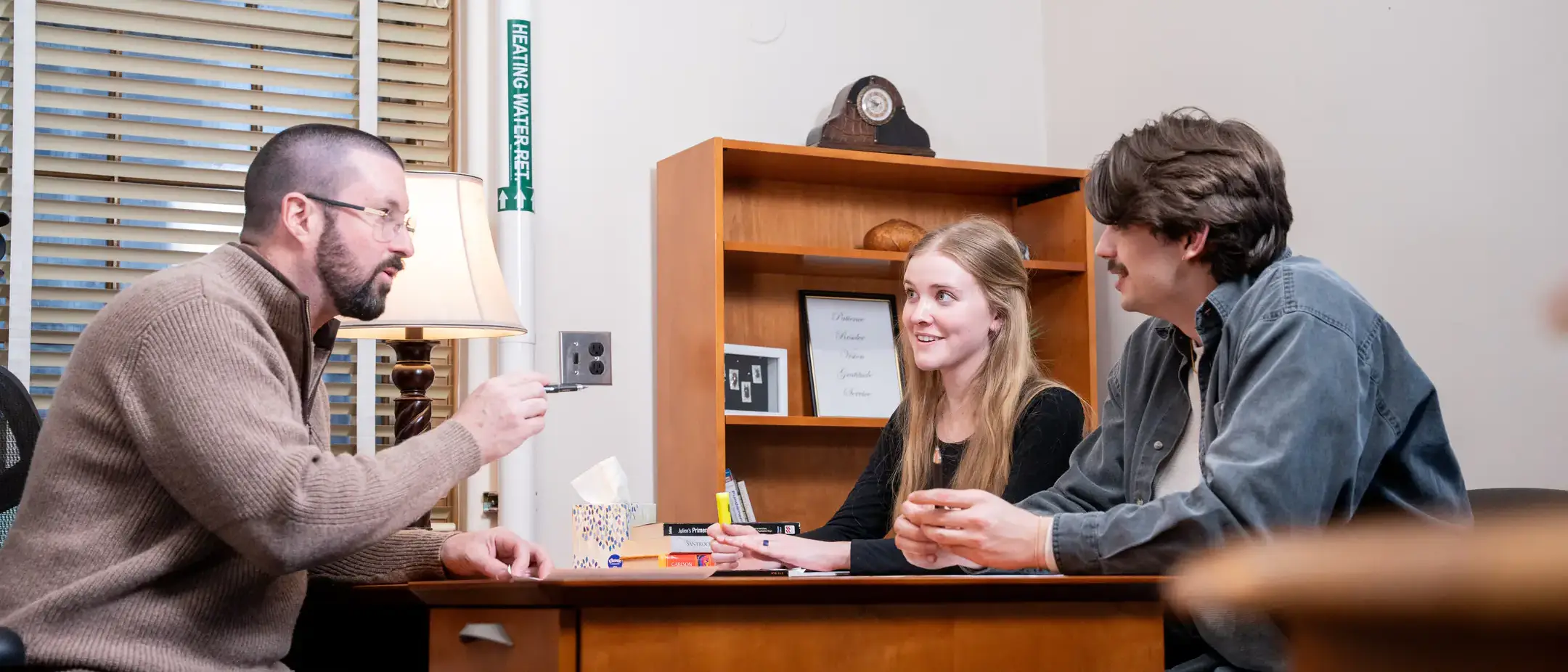Psychology department head Dr. Ben Barton collaborates with Graduate student Wade Scott and student Katelynn Kjorness in the Department of Psychology and Communications while researching addictions.