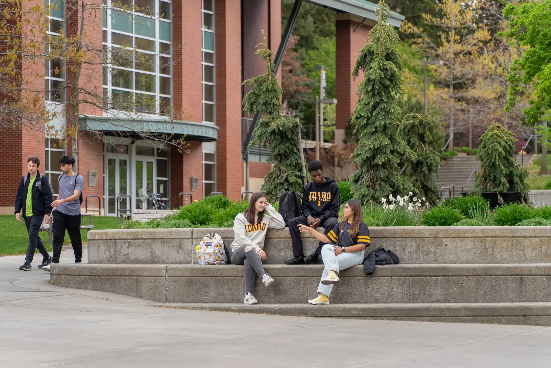 Students gather and socialize along the Academic Mall on Monday, May 5, 2025.