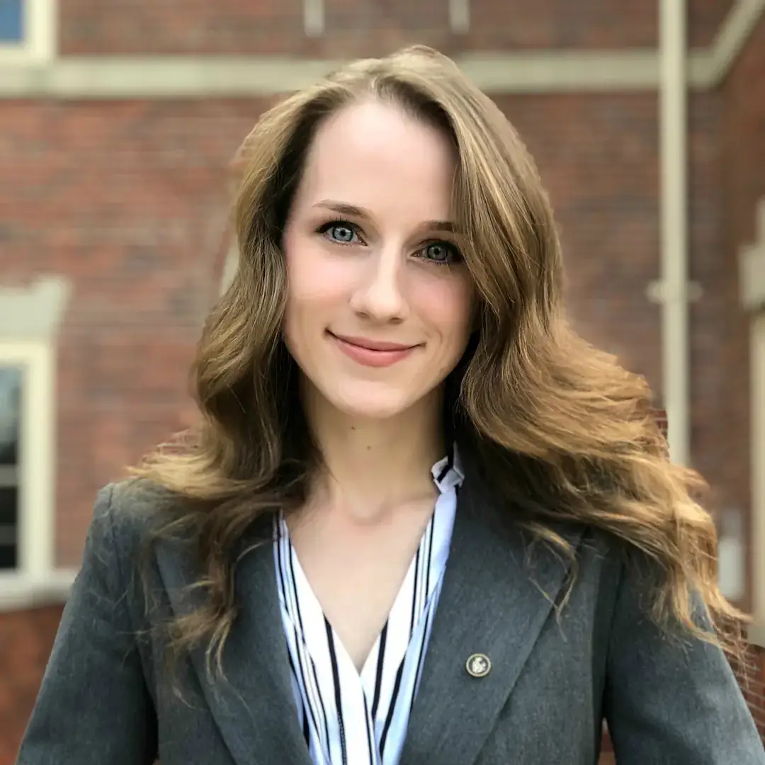 A portrait of a woman wearing a blazer.