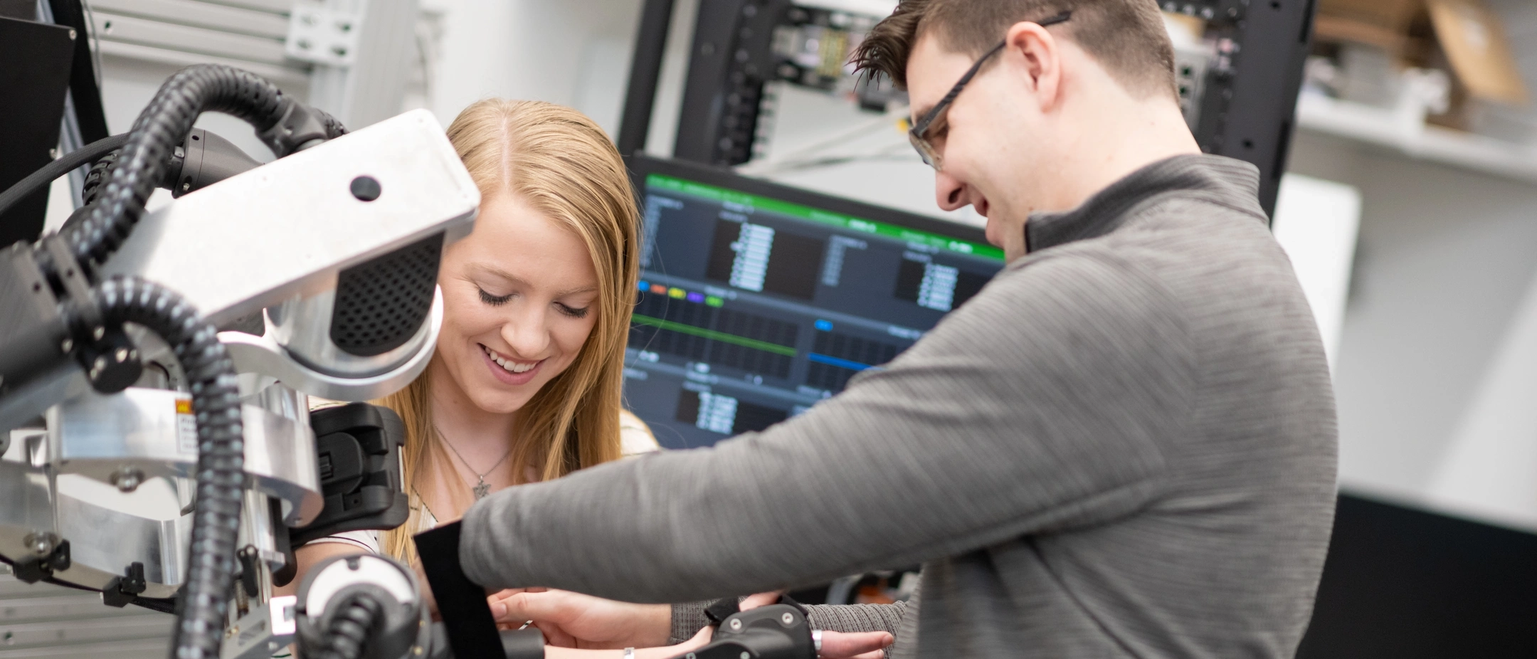 University of Idaho College of Engineering students and faculty working with therapeutic robots made to assist in physical therapy.