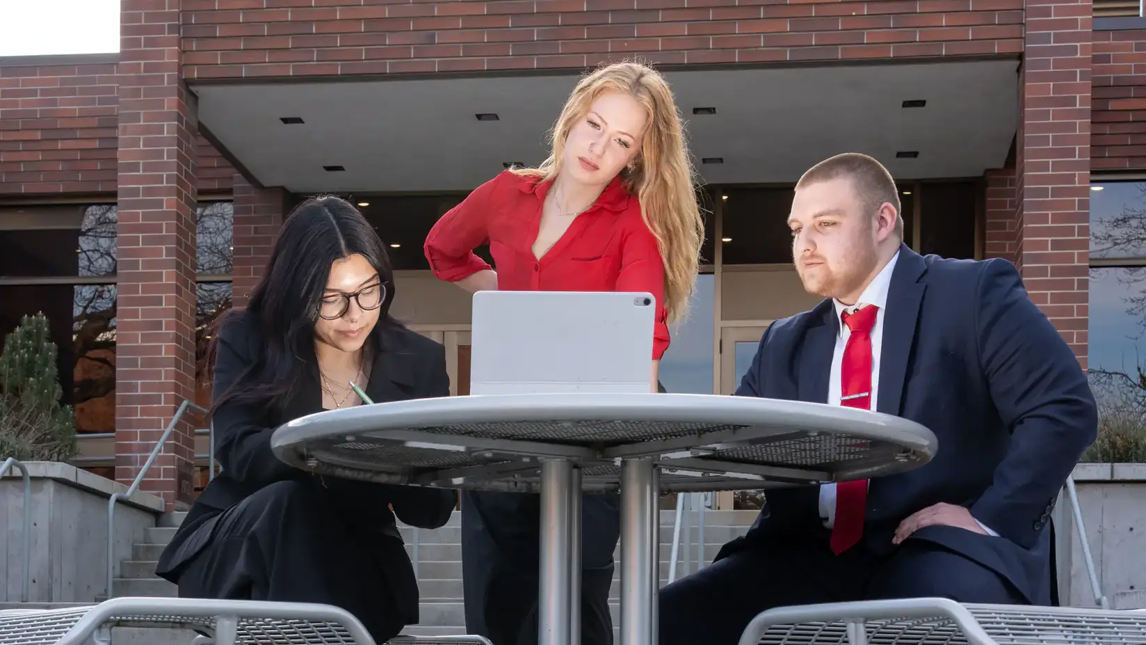 Pictured from left are political science students Erika Amaral, Mila Rice, and Raleigh Halgren, who all participate on the mock trial team and plan to enter law school.