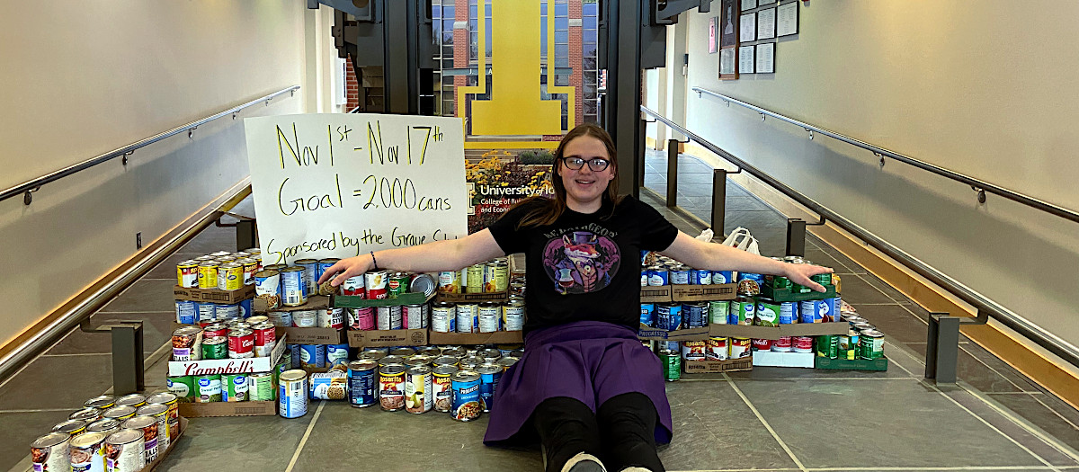 University of Idaho student, Zoe Evans stacks cans of food she purchased for a donation.