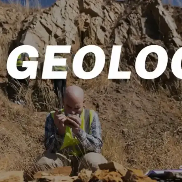 Geology thumbnail of a man investigating a rock.