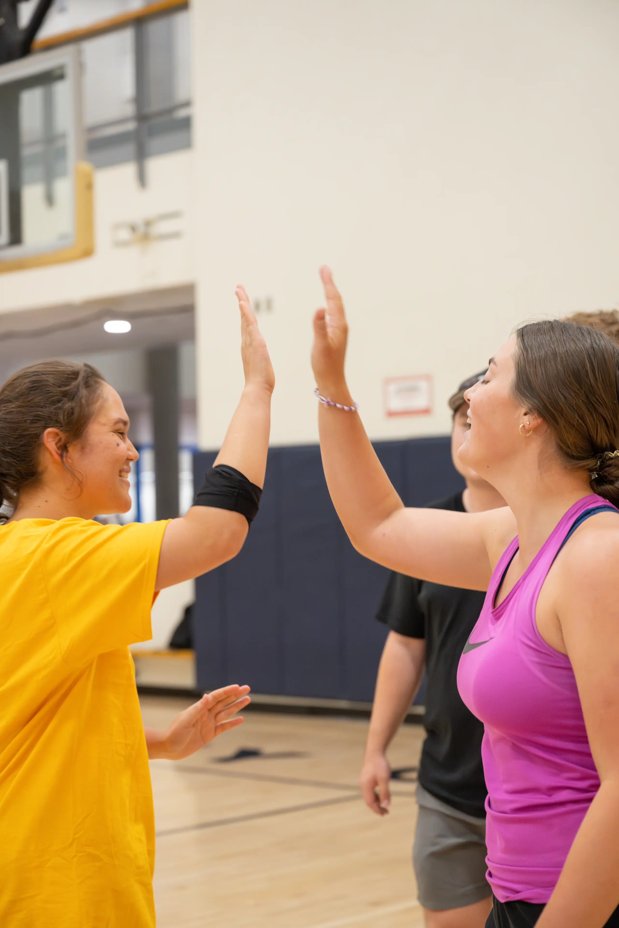 Two teammates high five.
