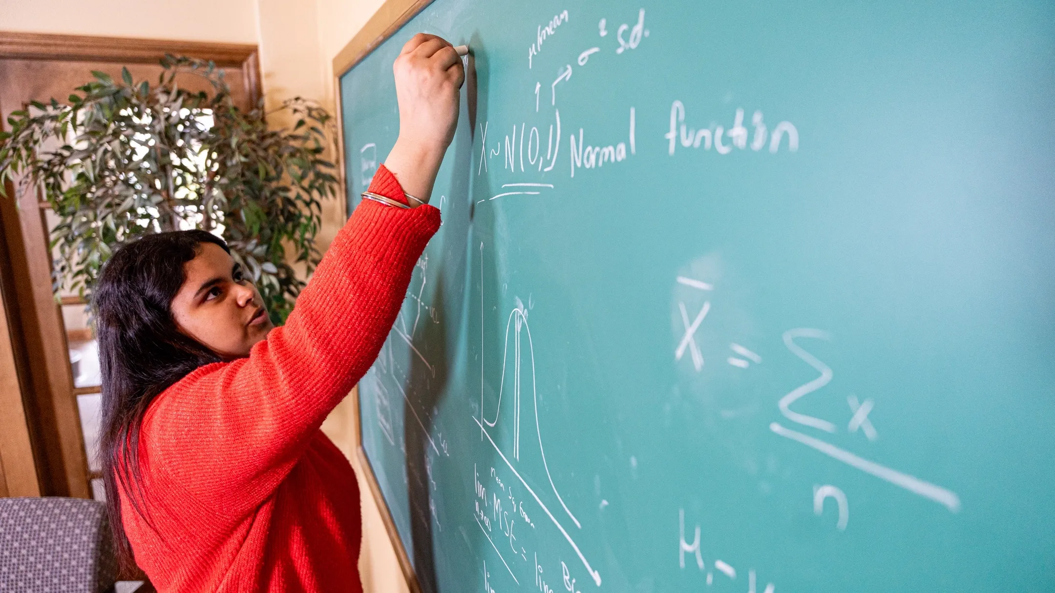 Graduation story on Avneet Virk, a Mathematics and Statistical Science student, who is pictured in Brink Hall on March 27, 2025.
