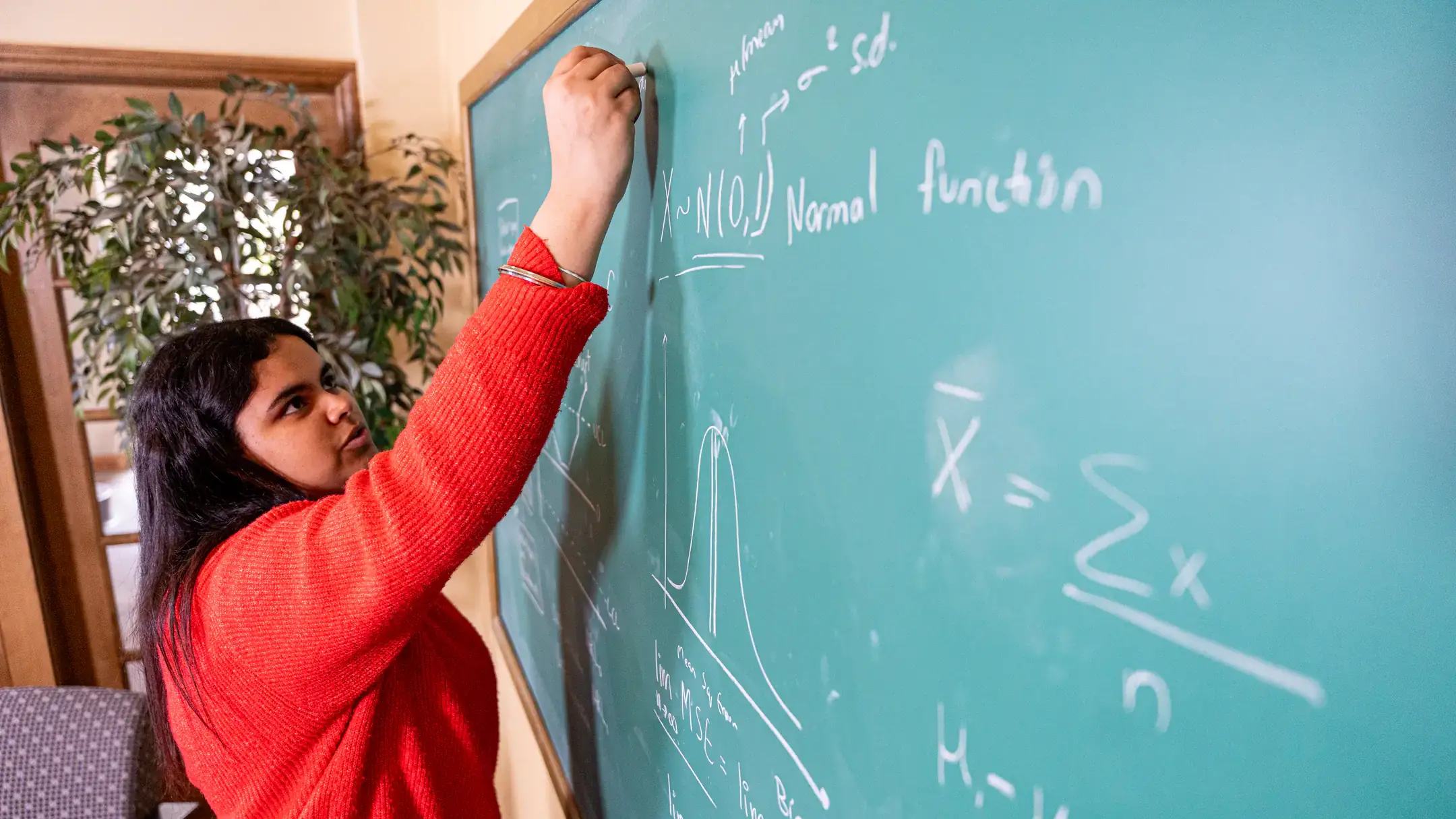 Graduation story on Avneet Virk, a Mathematics and Statistical Science student, who is pictured in Brink Hall on March 27, 2025.