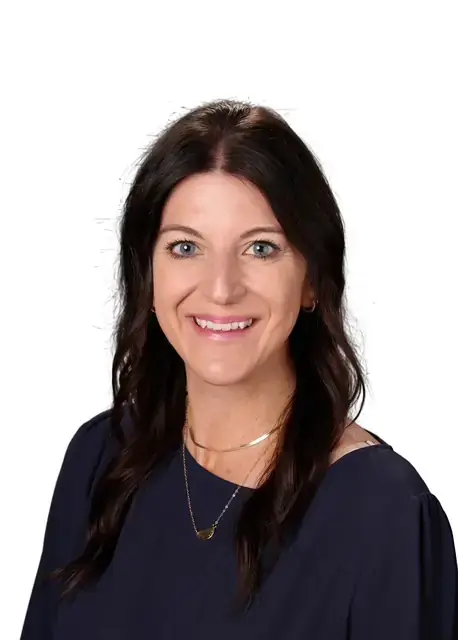 Savannah Fritz, a woman with dark hair and dark blue shirt. 