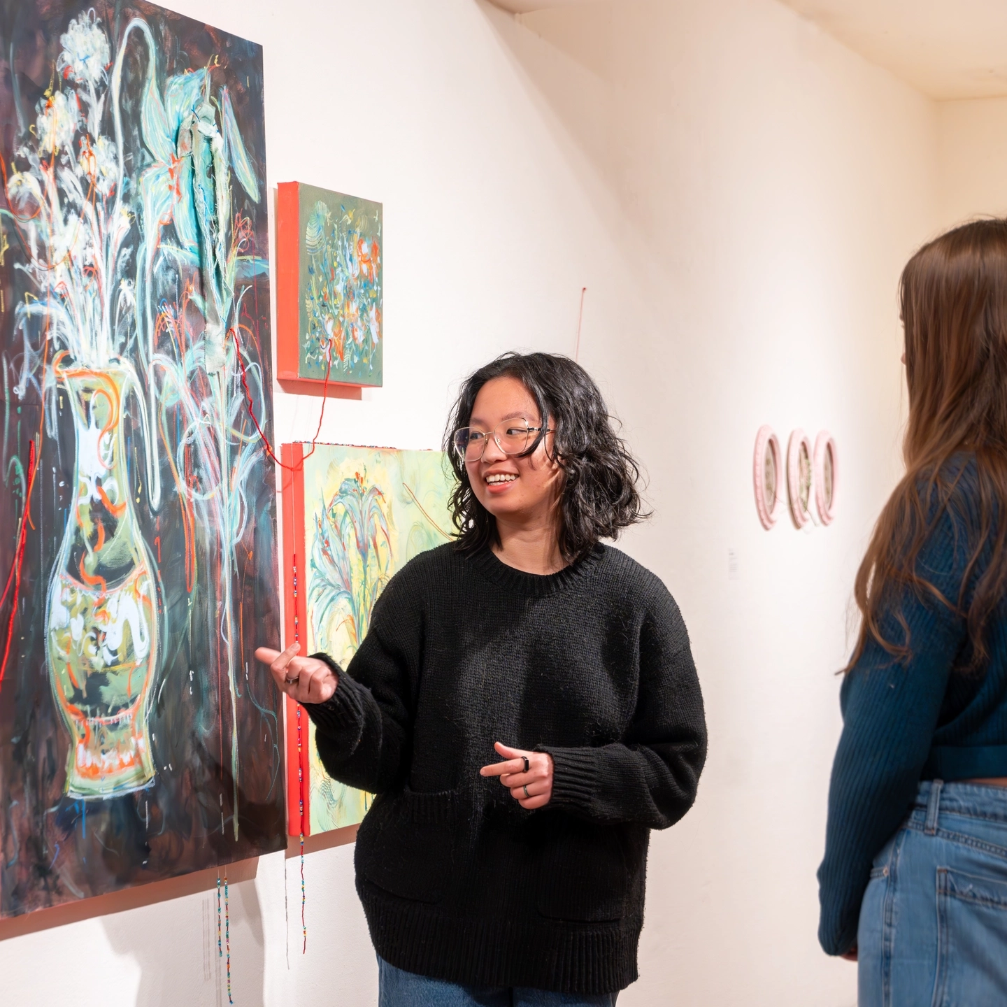 Photos of students and their respective work at the BFA Exhibition in the Ridenbaugh gallery in Moscow. Pictured is Olivia Pham.