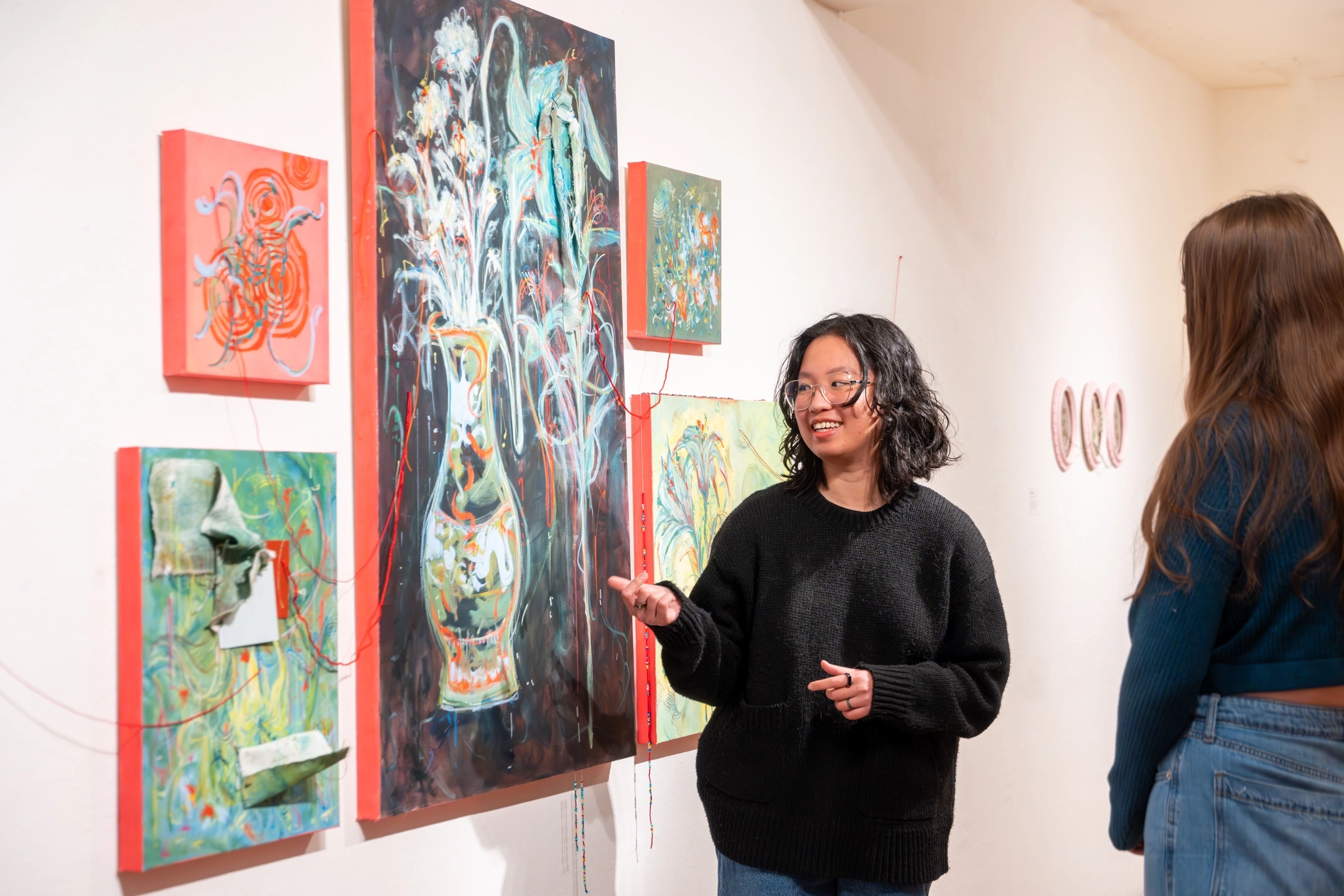 Photos of students and their respective work at the BFA Exhibition in the Ridenbaugh gallery in Moscow. Pictured is Olivia Pham.