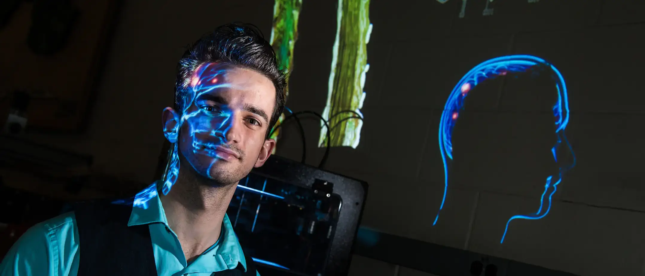 Man in front of projector