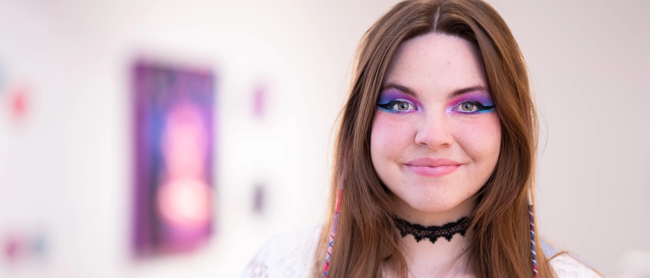 Photo shoot featuring student Kim Timmons with her art projects for Vandals in Focus.