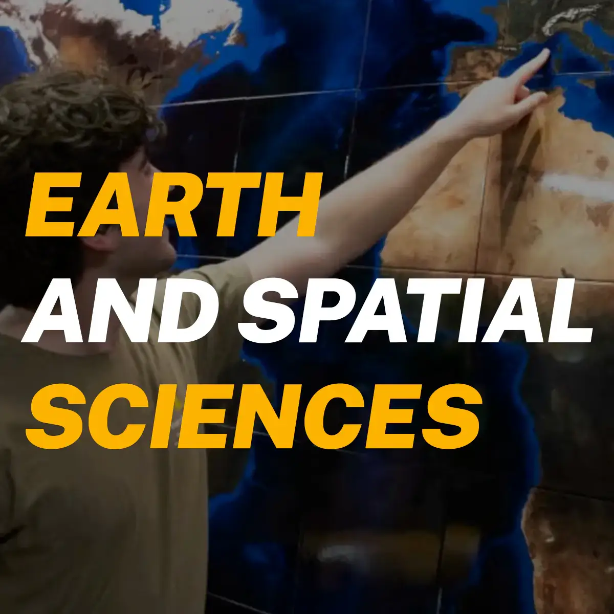 Student points to item on map, with the words "Earth and Spatial Sciences" bolded next to him