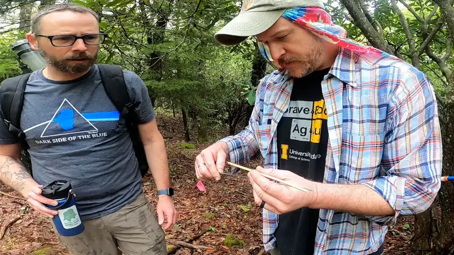 Professor Grant Harley and a colleague inspect a core sample.
