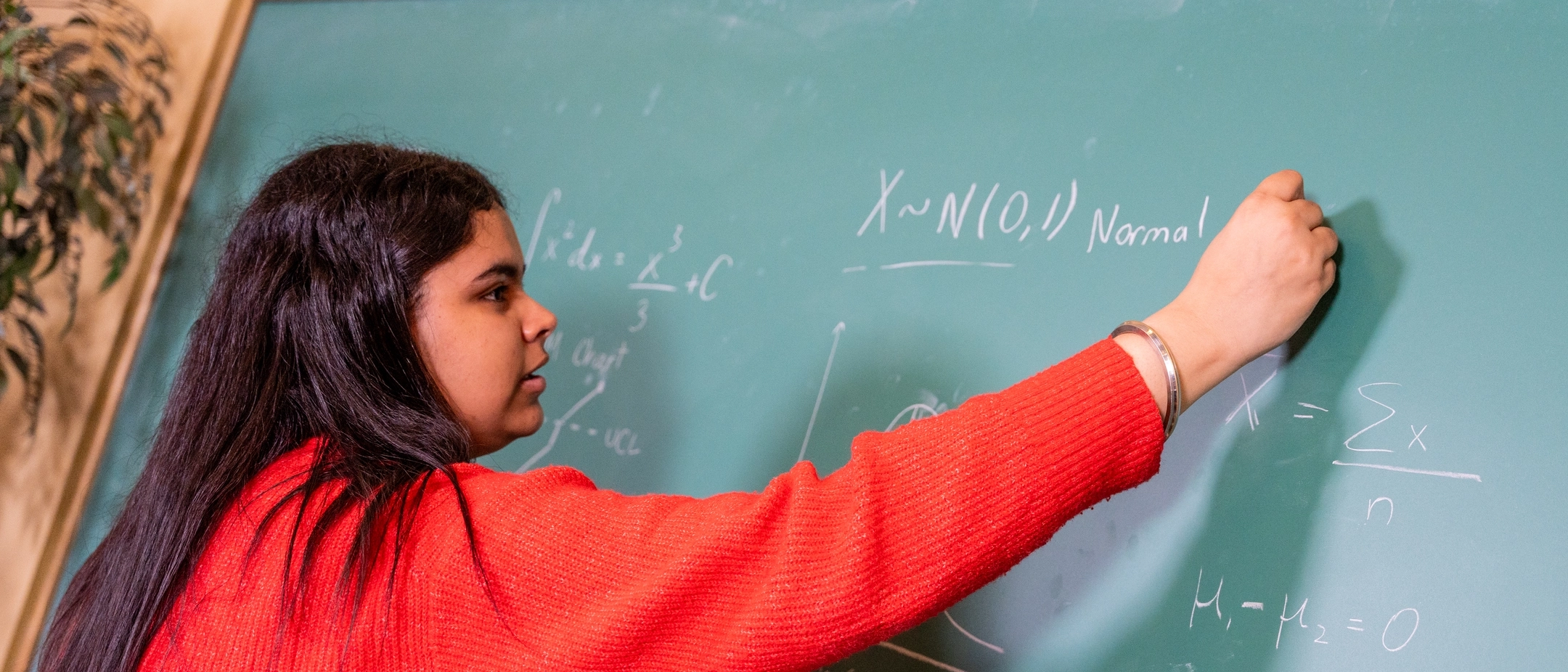 Graduation story on Avneet Virk, a Mathematics and Statistical Science student, who is pictured in Brink Hall on March 27, 2025.