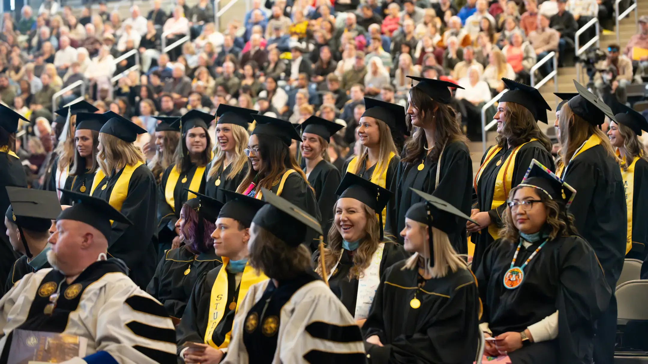 A group of students in their cap and gown during graduation