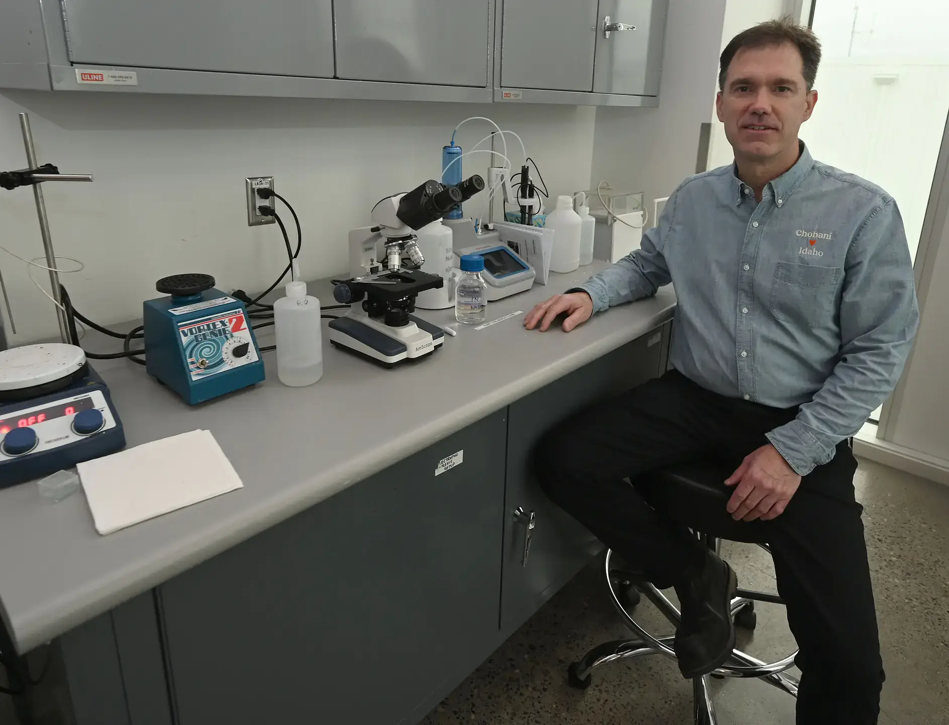 Peter Krell sitting at the counter of Chobani's food lab at the Twin Falls plant