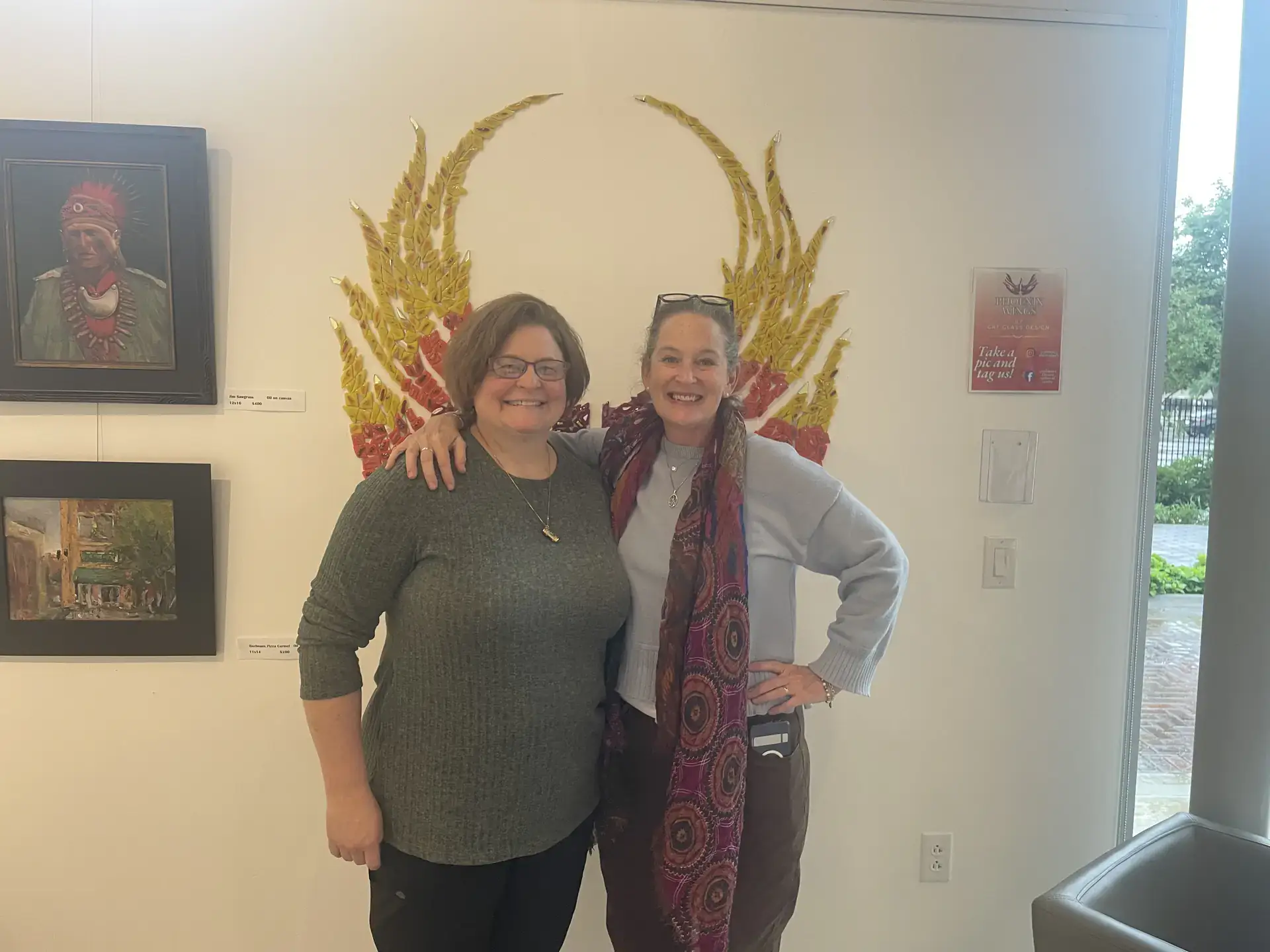 Trace Davis posed in front of an art piece