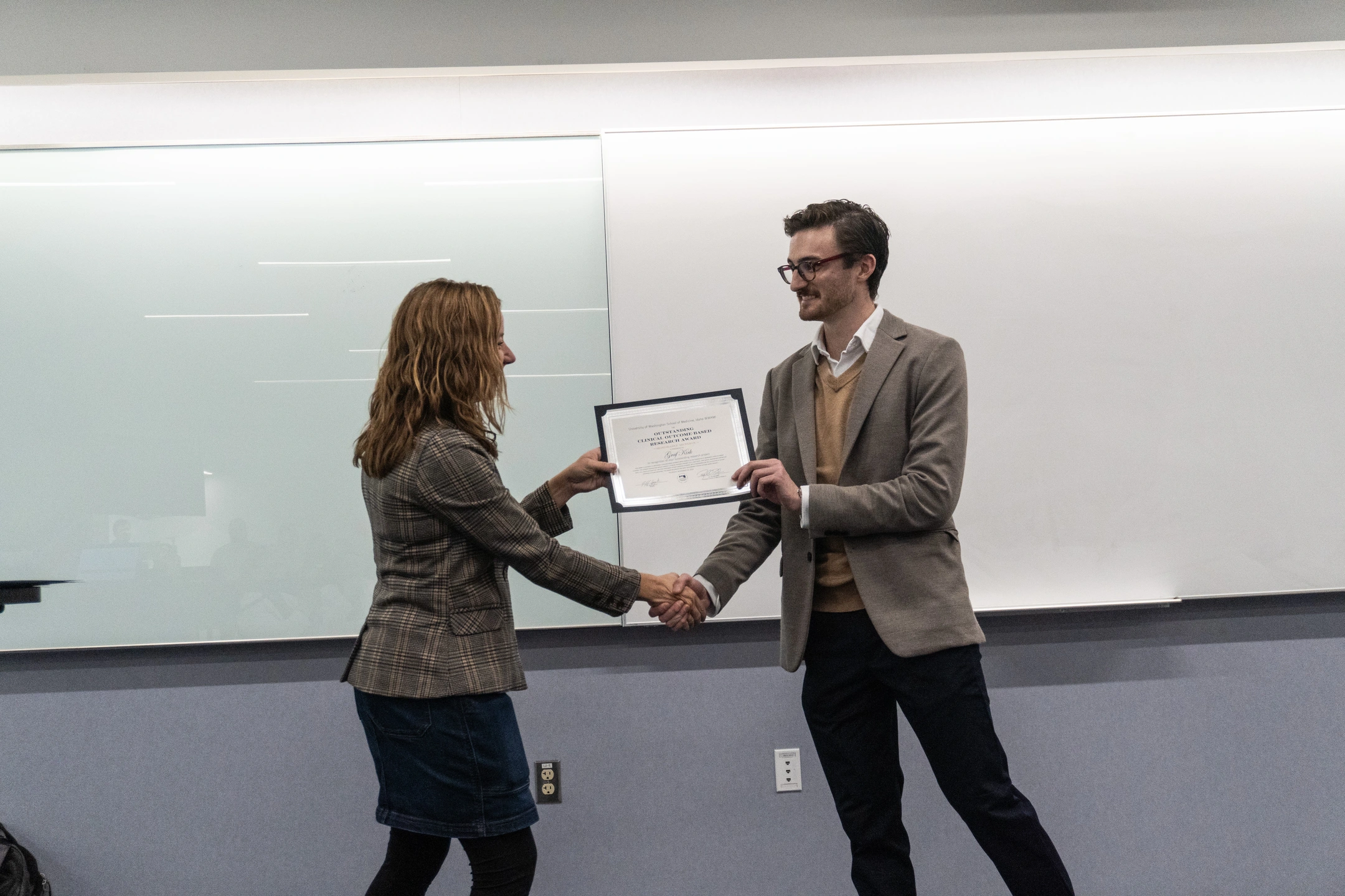 Graf Kirk accepts the Outstanding Clinical Outcome Based Research Award.