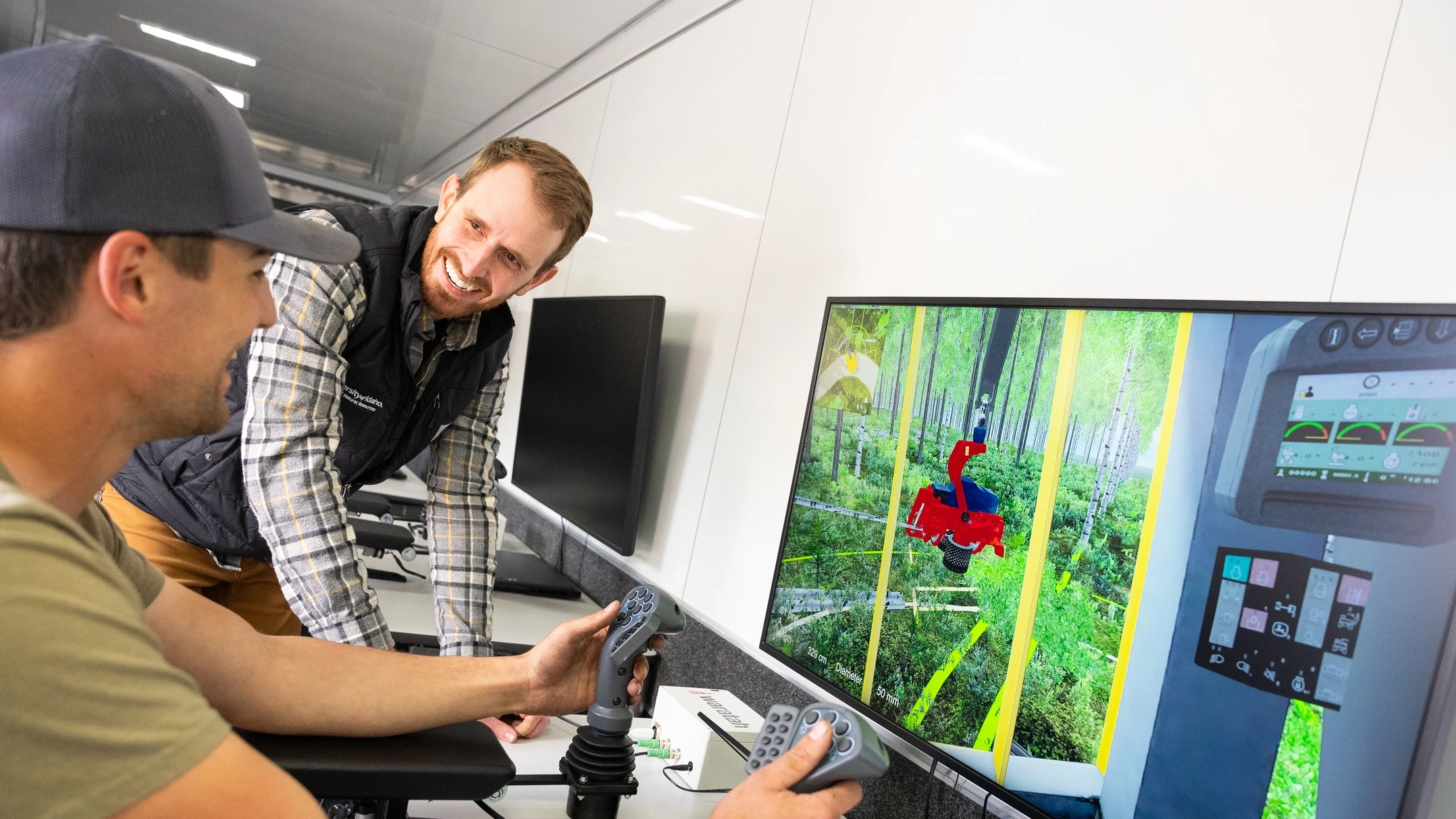 Forest, Rangeland, and Fire Sciences faculty Ryer Becker working with student John Nicholson on a logging demo simulation video.