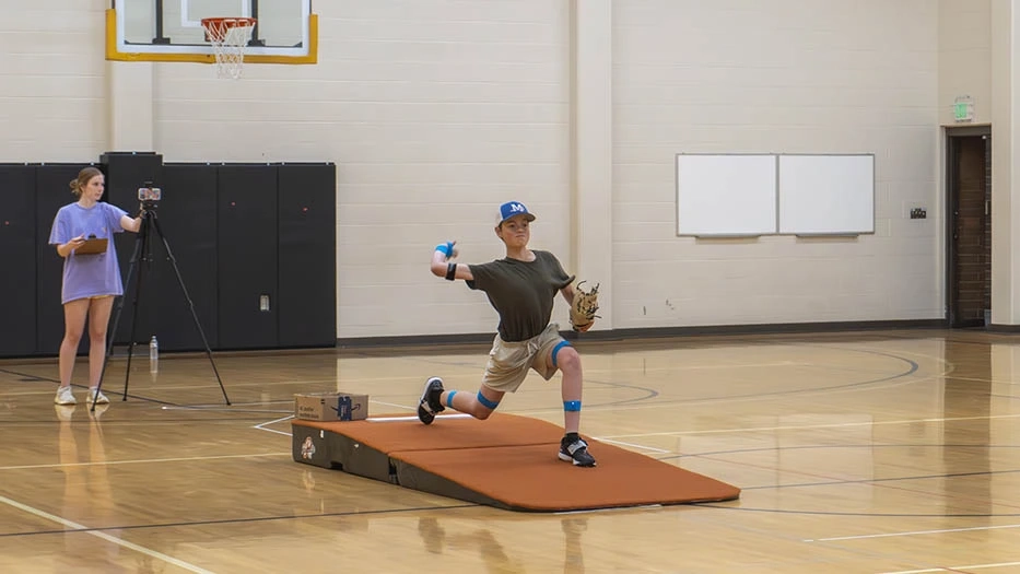 Study participant pitching a baseball
