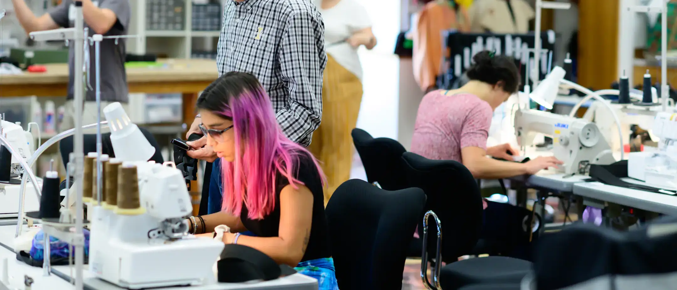 College of Agricultural and Life Sciences Family and Consumer Sciences textiles students making custom belts for the UI Marching Band to use in a performance during homecoming.
