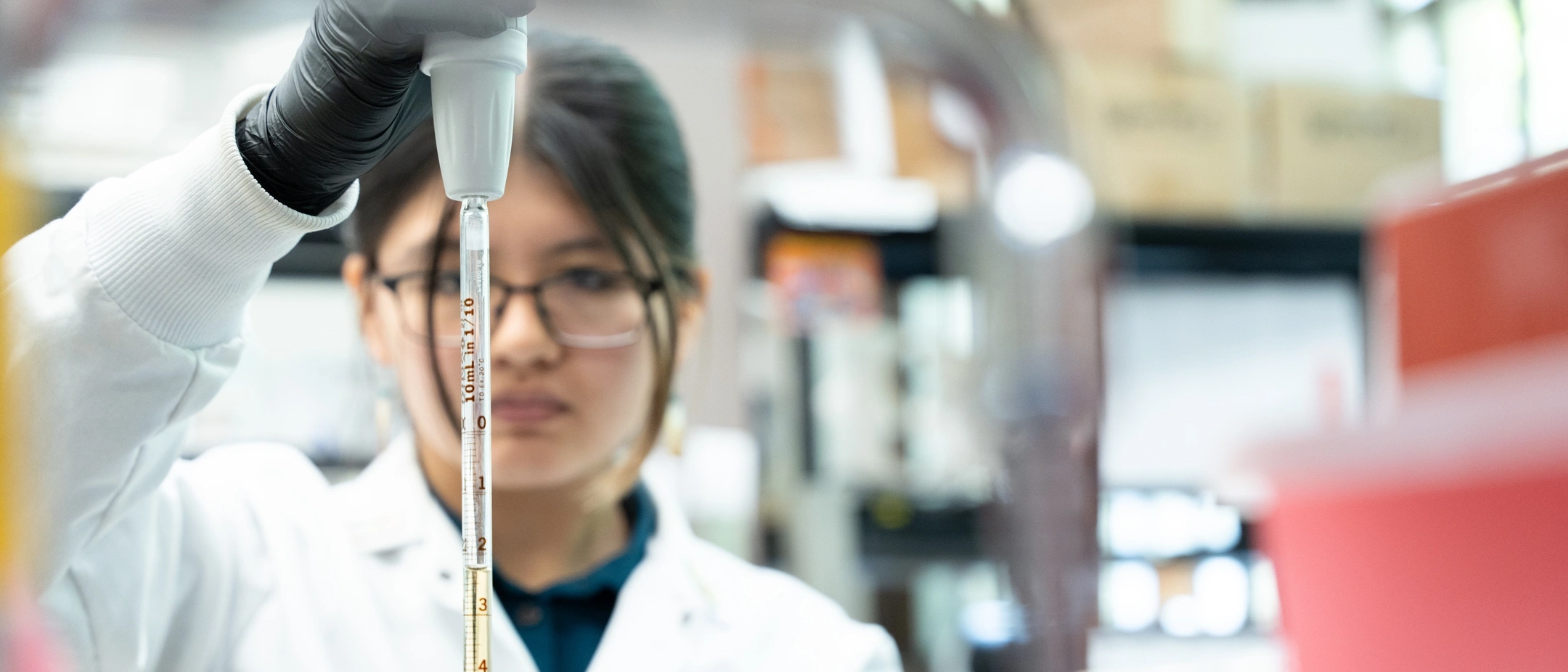 Goldwater scholar Dayna Bruiton from Caldwell, Idaho working in the Paul Rowley lab working with Yeast growth medium.
