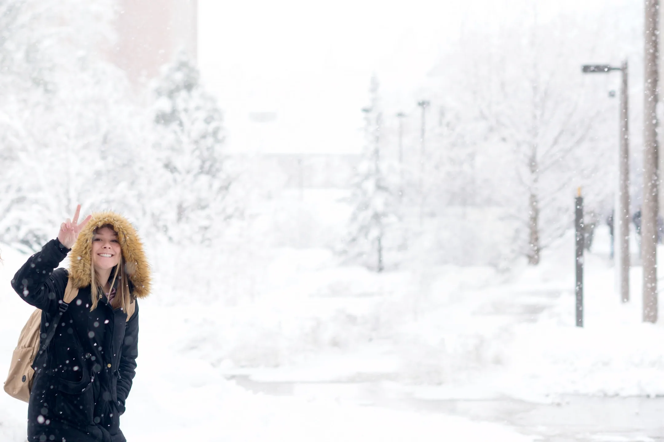 Students on campus in winter snow