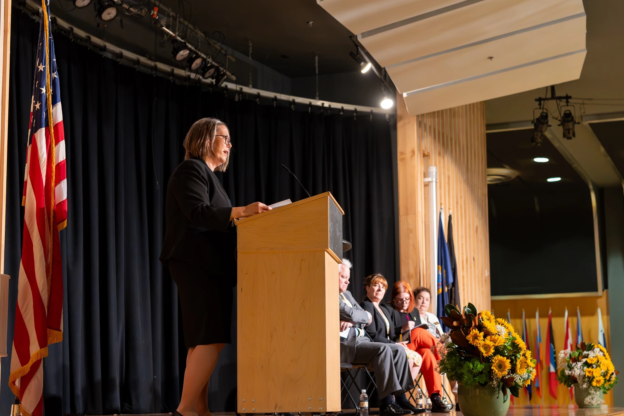 A woman speaking to an audience