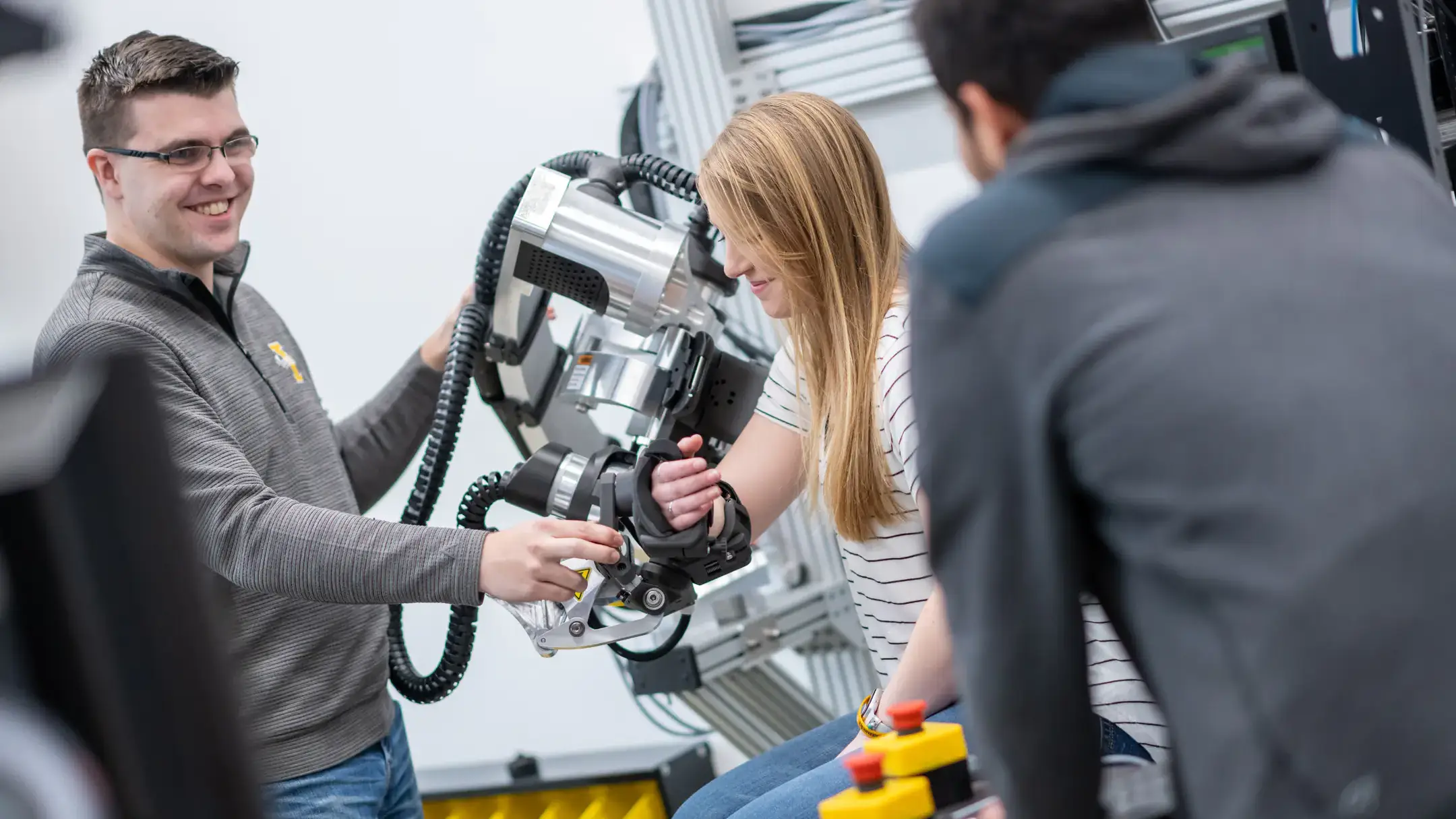 University of Idaho College of Engineering students and faculty working with therapeutic robots made to assist in physical therapy.