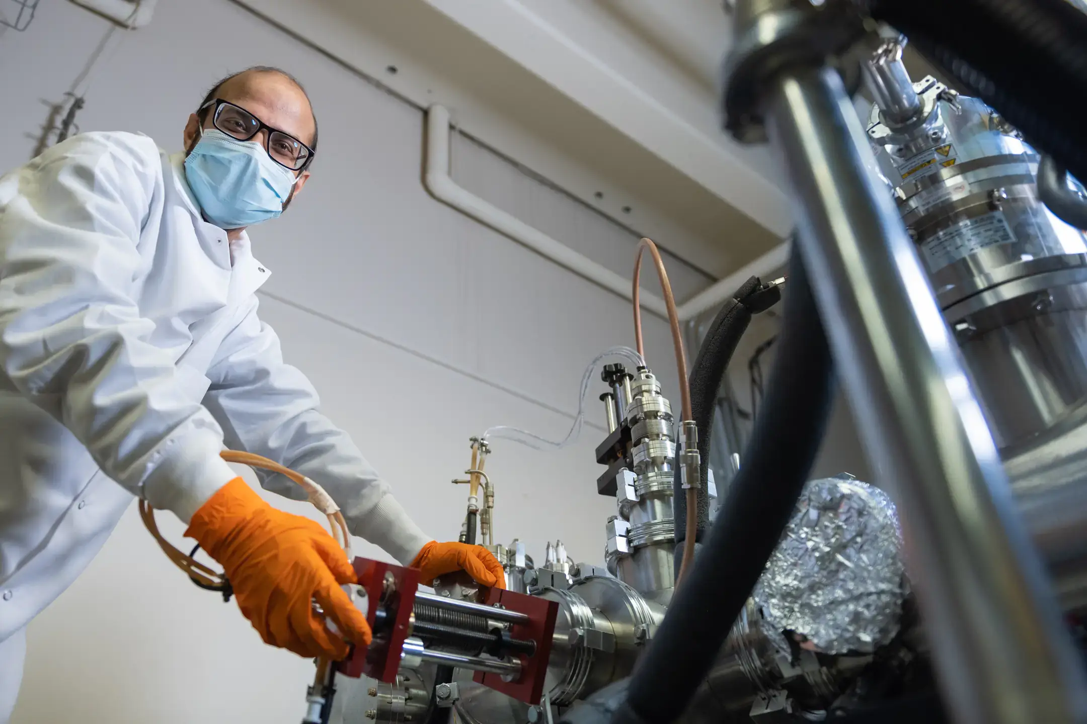 College of Science advanced semi conductor physics students break down and fix Dr. You Qiang's nanotunnel microscope
