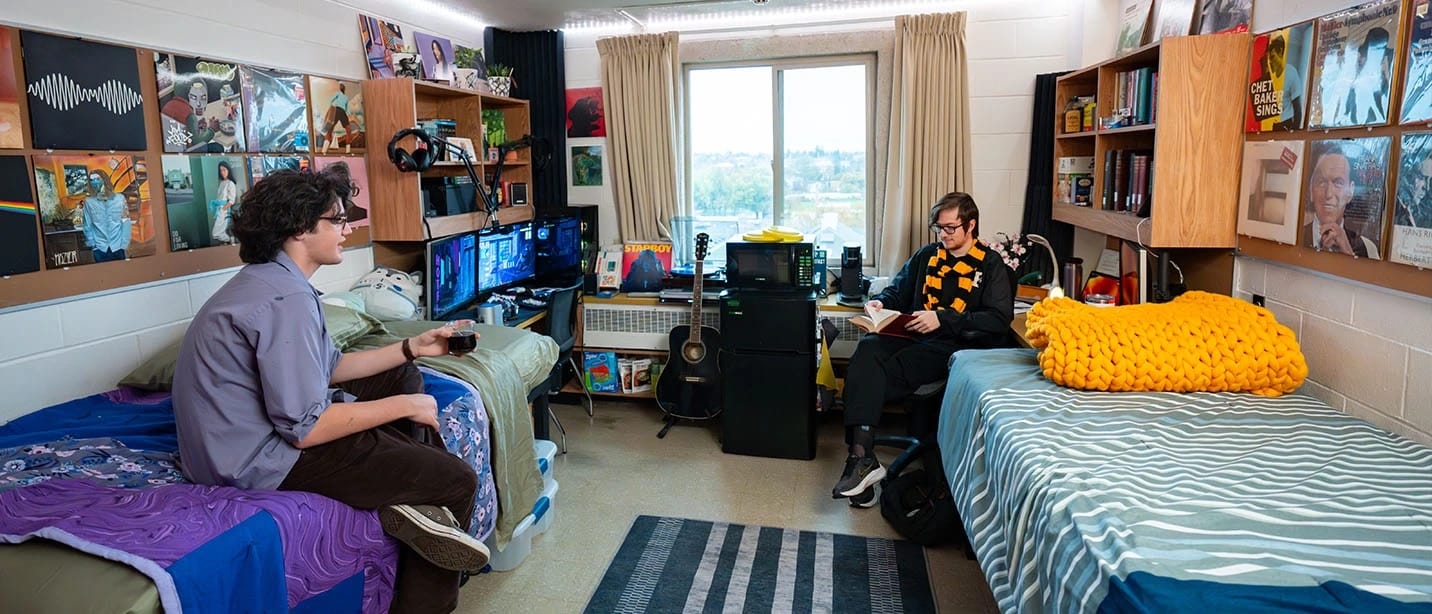 Students sit in their shared room