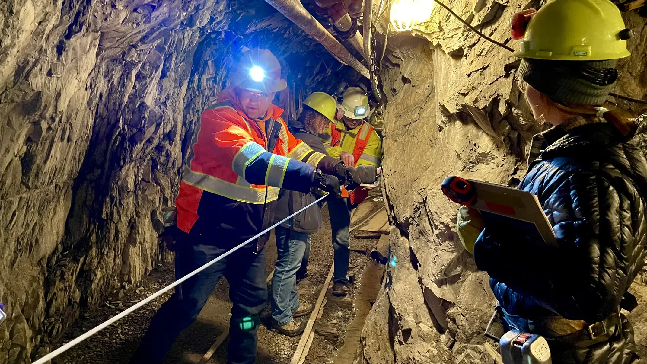 People working in an underground tunnel.